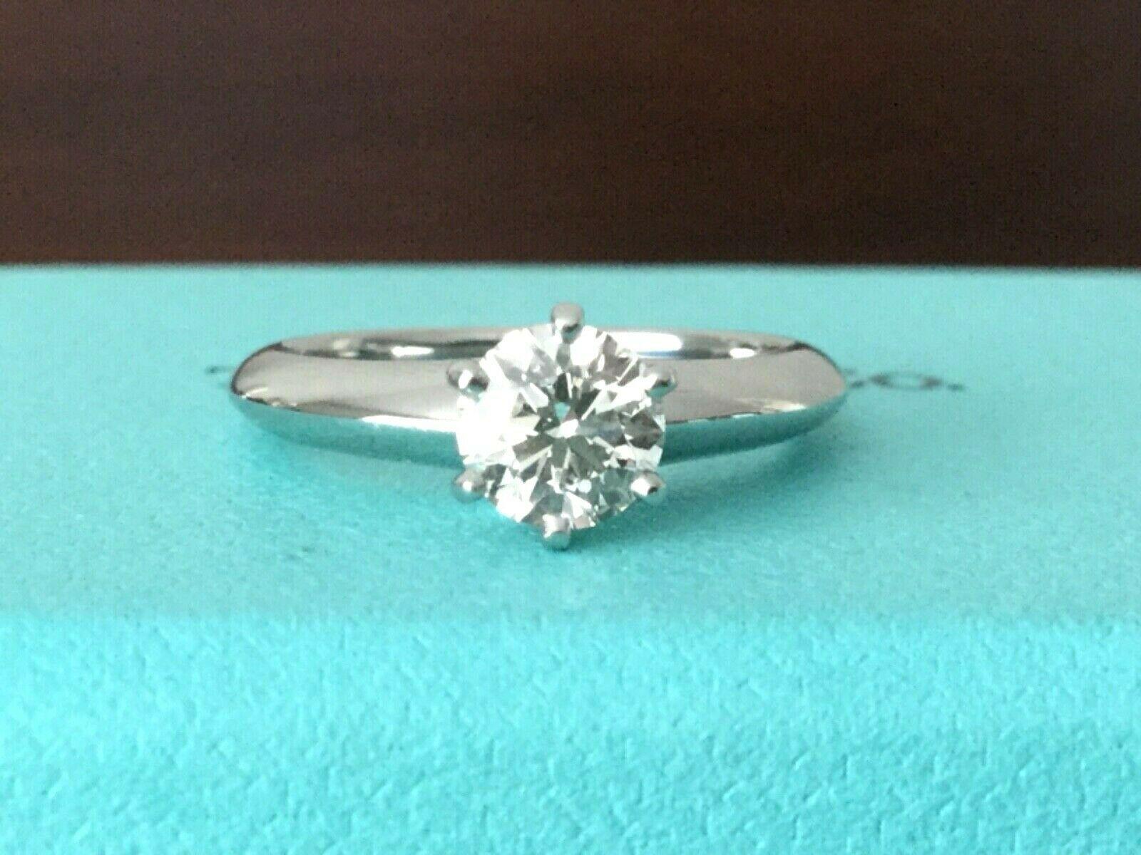 Being offered for your consideration is a like new Tiffany & Co Platinum and Diamond .78 carat natural round engagement ring set in the classic 6 prong setting. 

The ring has been professionally cleaned and polished to like new condition and