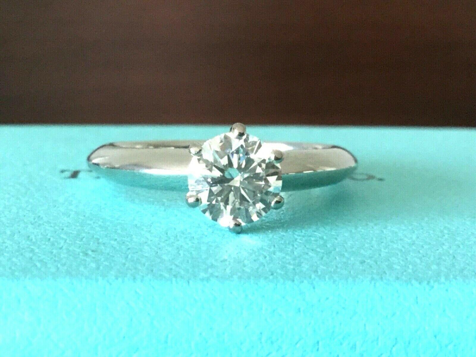 Being offered for your consideration is a stunning Tiffany & Co Platinum and Diamond .80 carat natural round engagement ring set in the classic 6 prong setting.  The ring shows like brand new! 

This ring currently retails at Tiffany's for $9,000