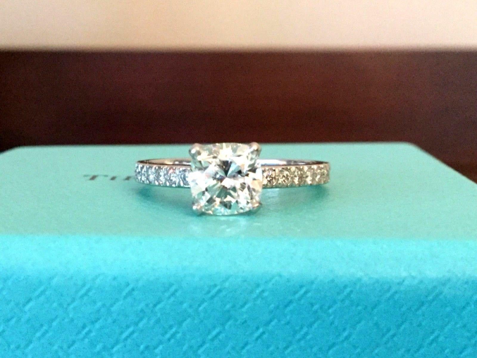 Being offered for your consideration is a like new Tiffany & Co Platinum and Diamond .95 carat natural cushion cut NOVO engagement ring set in the classic NOVO pave diamond band..  This ring was hardly worn and can pass for a BRAND NEW ring!  There