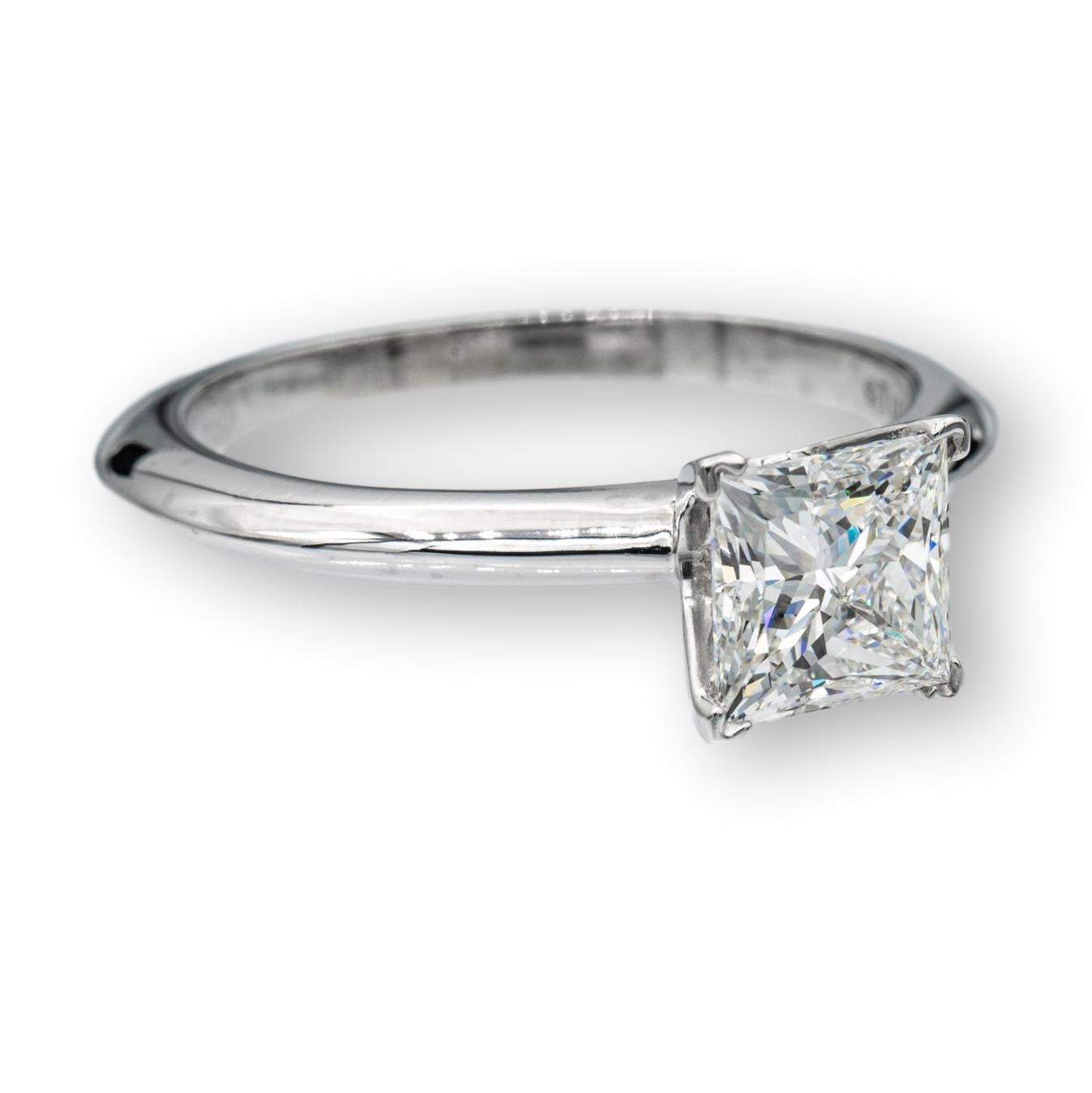 Tiffany & Co. Diamond Engagement ring featuring a princess cut 0.97 ct Center, graded F color , and VVS1 Clarity, in Platinum.    This diamond Includes a GIA certificate with report number  2225288728. The Tiffany Crown Inscription is confirmed on