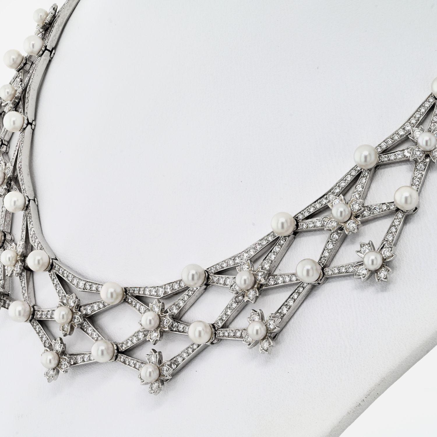 The Tiffany & Co platinum handcrafted diamond and cultured pearl bib necklace is a breathtaking work of art. Meticulously crafted with utmost precision and care, this exquisite piece showcases the perfect marriage of diamonds and cultured pearls.