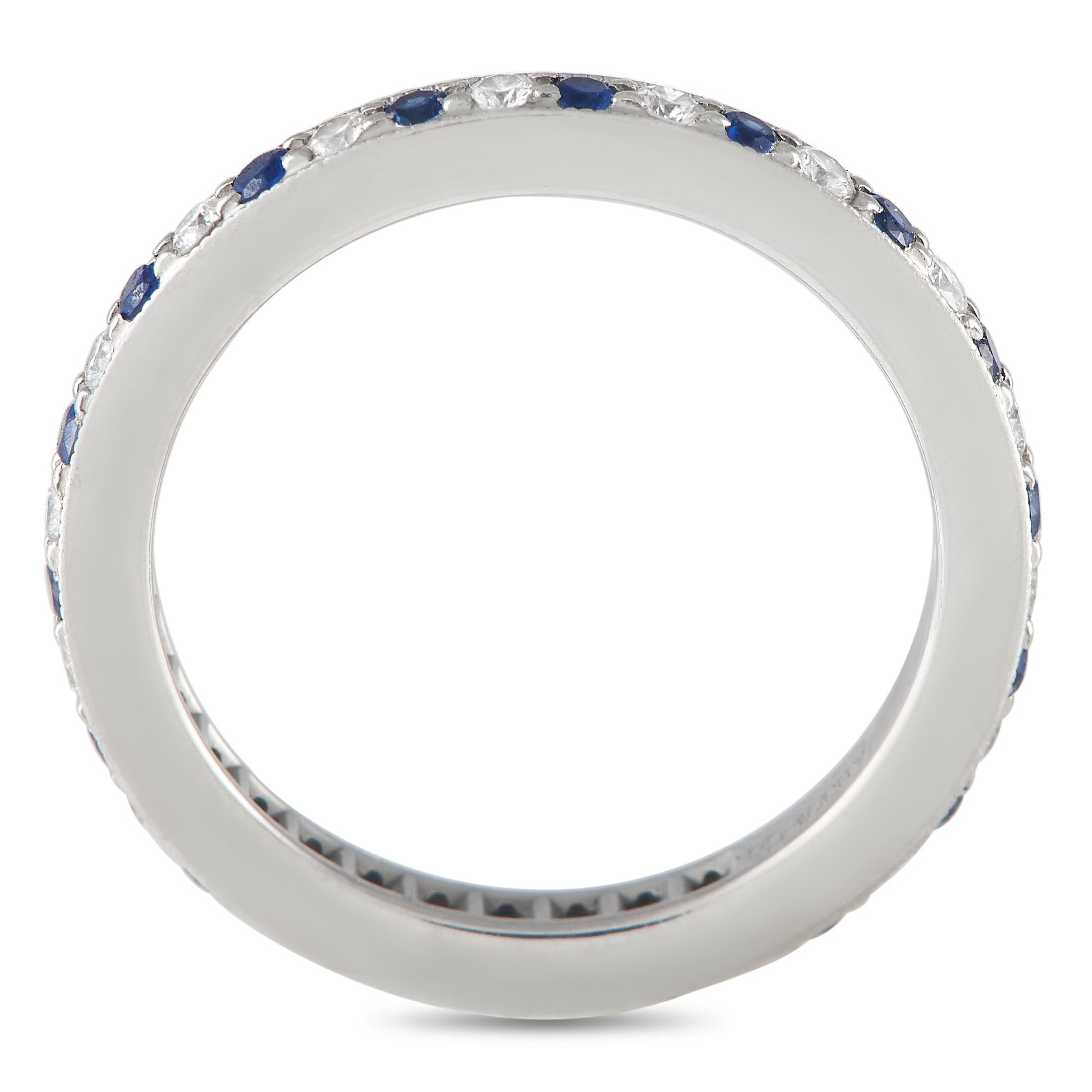 Bearing a full circle of alternating round diamonds and sapphires, this platinum eternity band would make a beautiful and timeless symbol of never-ending love. The band is only 2mm thick and has a ridged edge for that added texture and style. Get