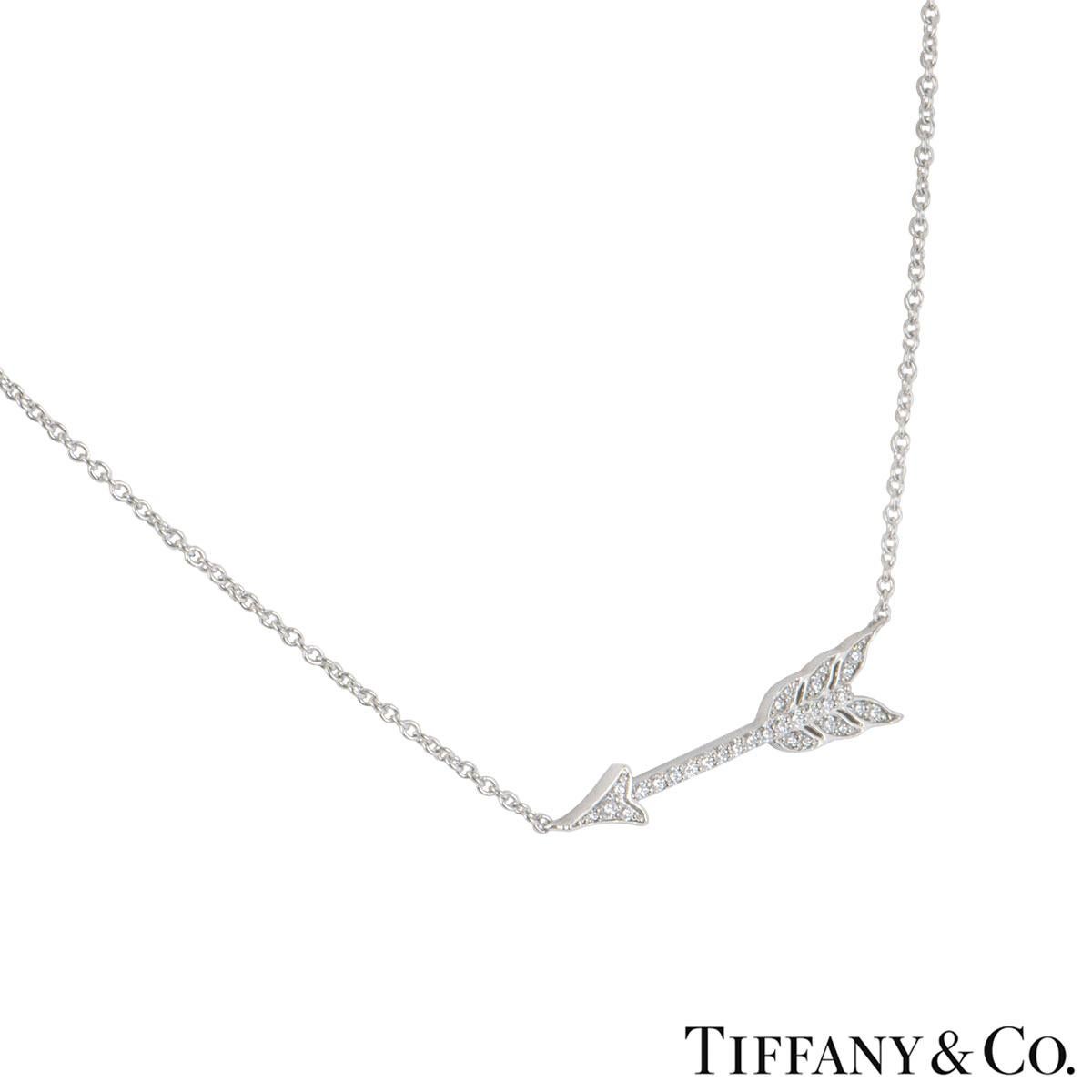 A platinum diamond pendant by Tiffany & Co. from the Hearts collection. The pendant comprises of a Arrow motif pave set with 30 round brilliant cut diamonds with an approximate total weight of 0.20ct. The arrow motif measures 2.30cm and the chain