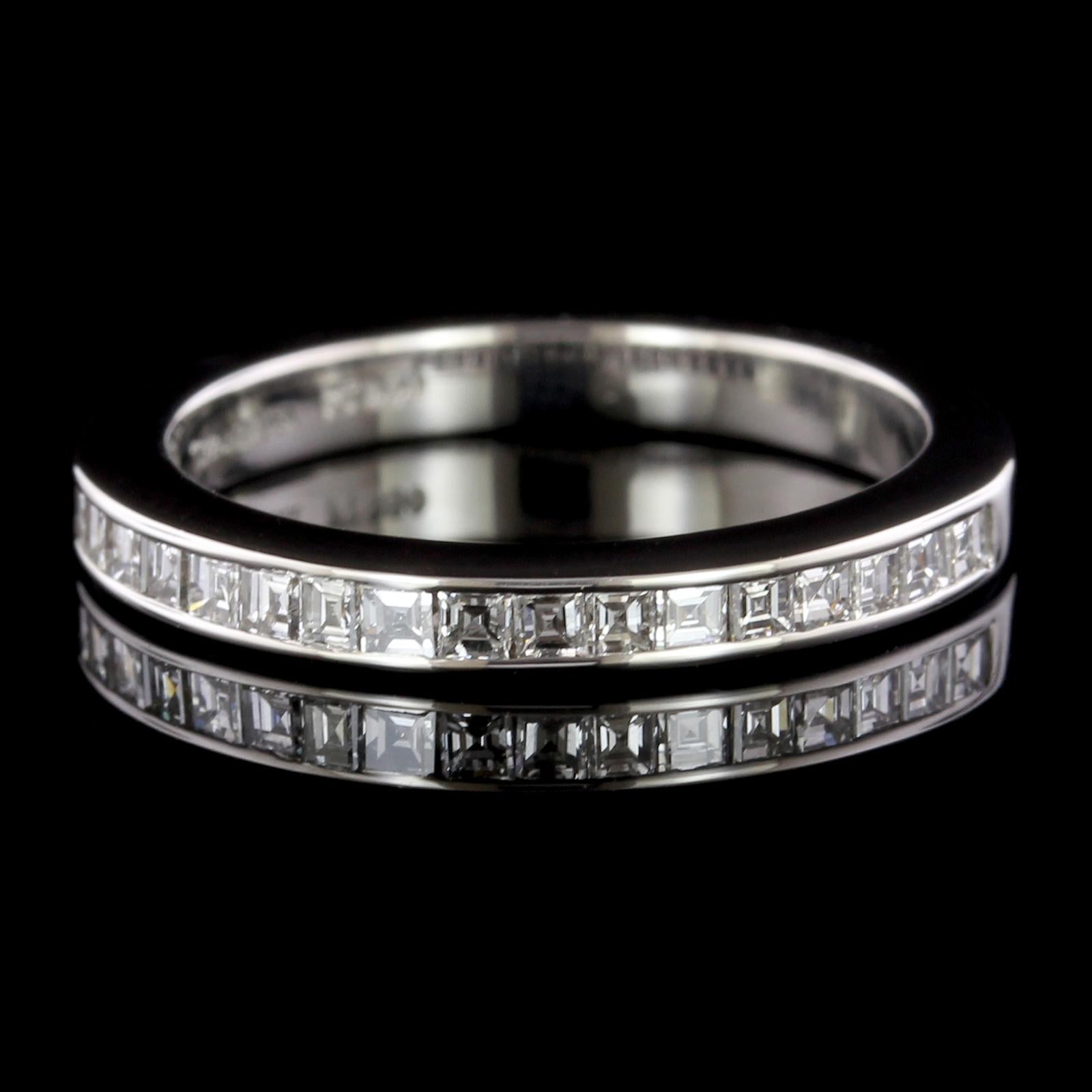 Tiffany & Co. Platinum Diamond Band. The band is channel set with 19 Asscher
cut diamonds, approx. total wt. .60cts., FG color, VS clarity, size 5 1/4.