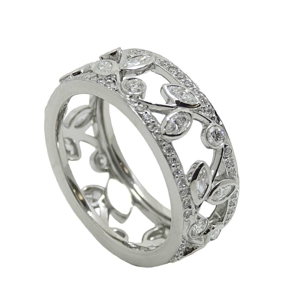 This Classic Style Platinum Tiffany & Co. Band Ring Has Beautiful Vine Style Detailing Diamonds Are Set Into The Vine Detailing For An Extra Touch Of Elegance and Weigh A Total Carat Weight Of 1.36 Carats. This Gorgeous Tiffany Ring Is A Size 9, and
