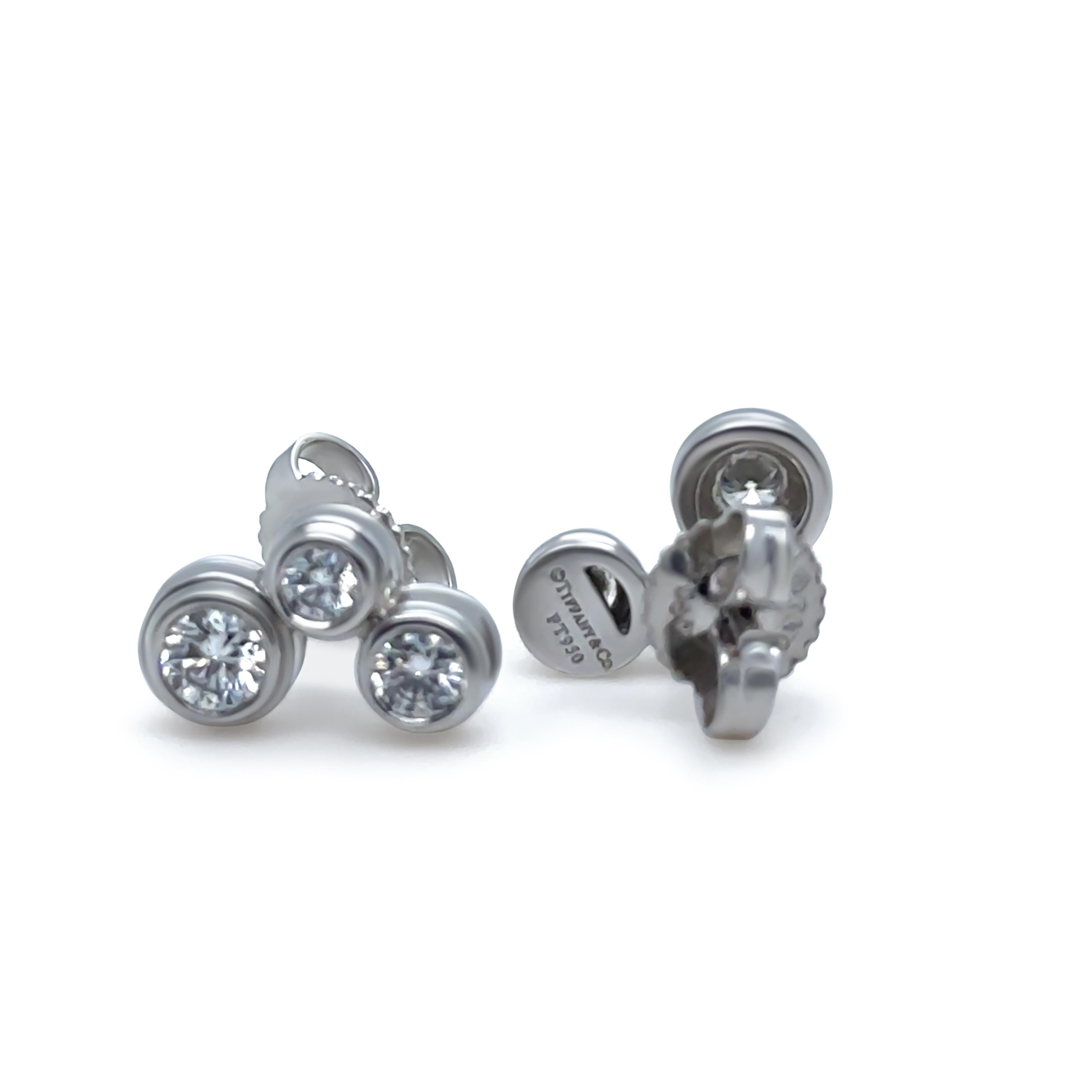 These elegant Tiffany & Co. Bubble earrings, crafted in luxurious platinum (PT950), feature a playful yet refined design. Each earring is set with three round brilliant-cut diamonds, collet-set in Tiffany’s signature bubble arrangement.

With a