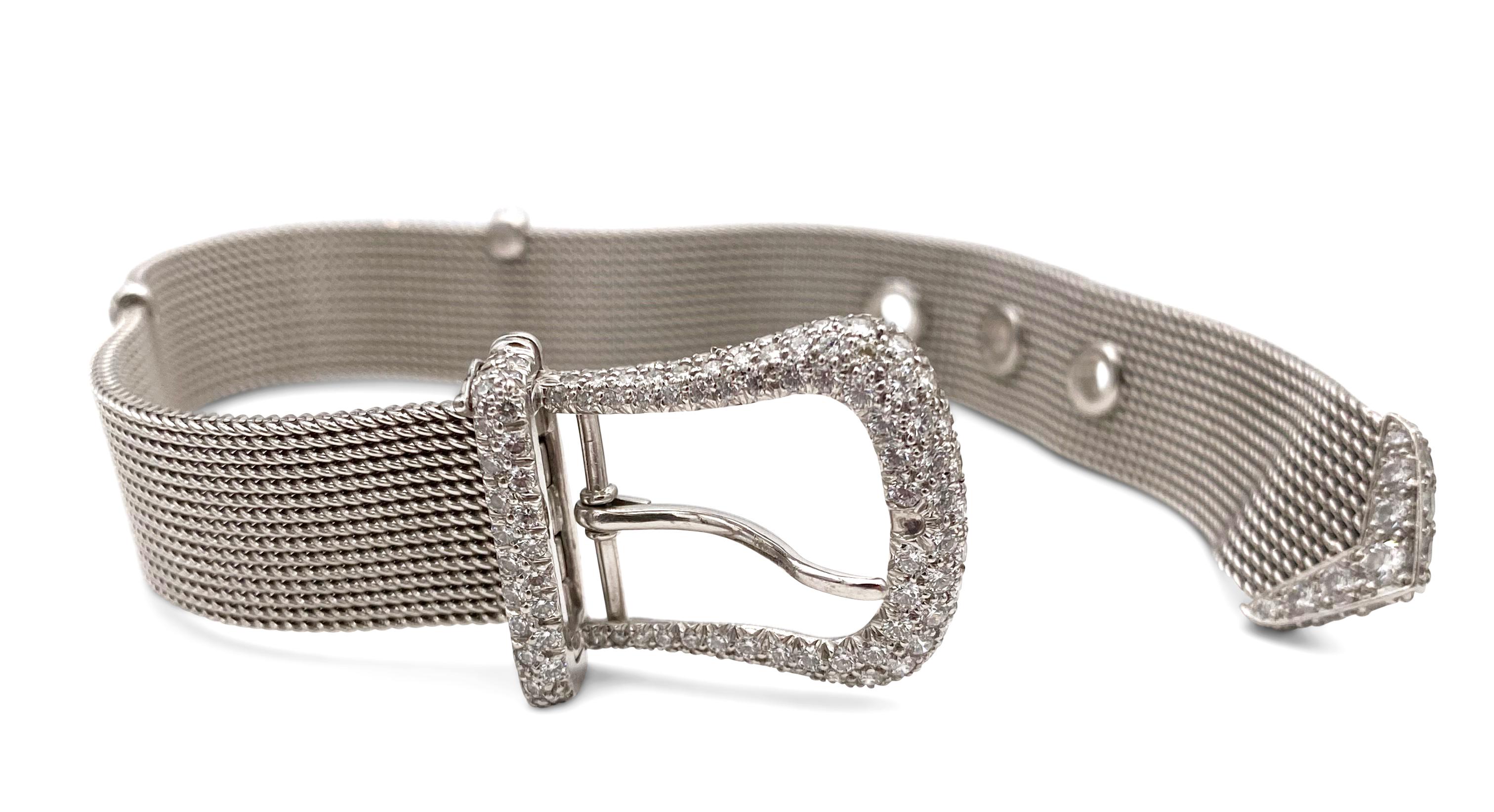 Authentic Tiffany & Co. buckle bracelet crafted in platinum and set with approx. 2.65 carats of round brilliant cut diamonds (F in color, VS clarity). The bracelet is 8 inches in length. Signed Tiffany & Co., 1997, PT 950. The bracelet comes with