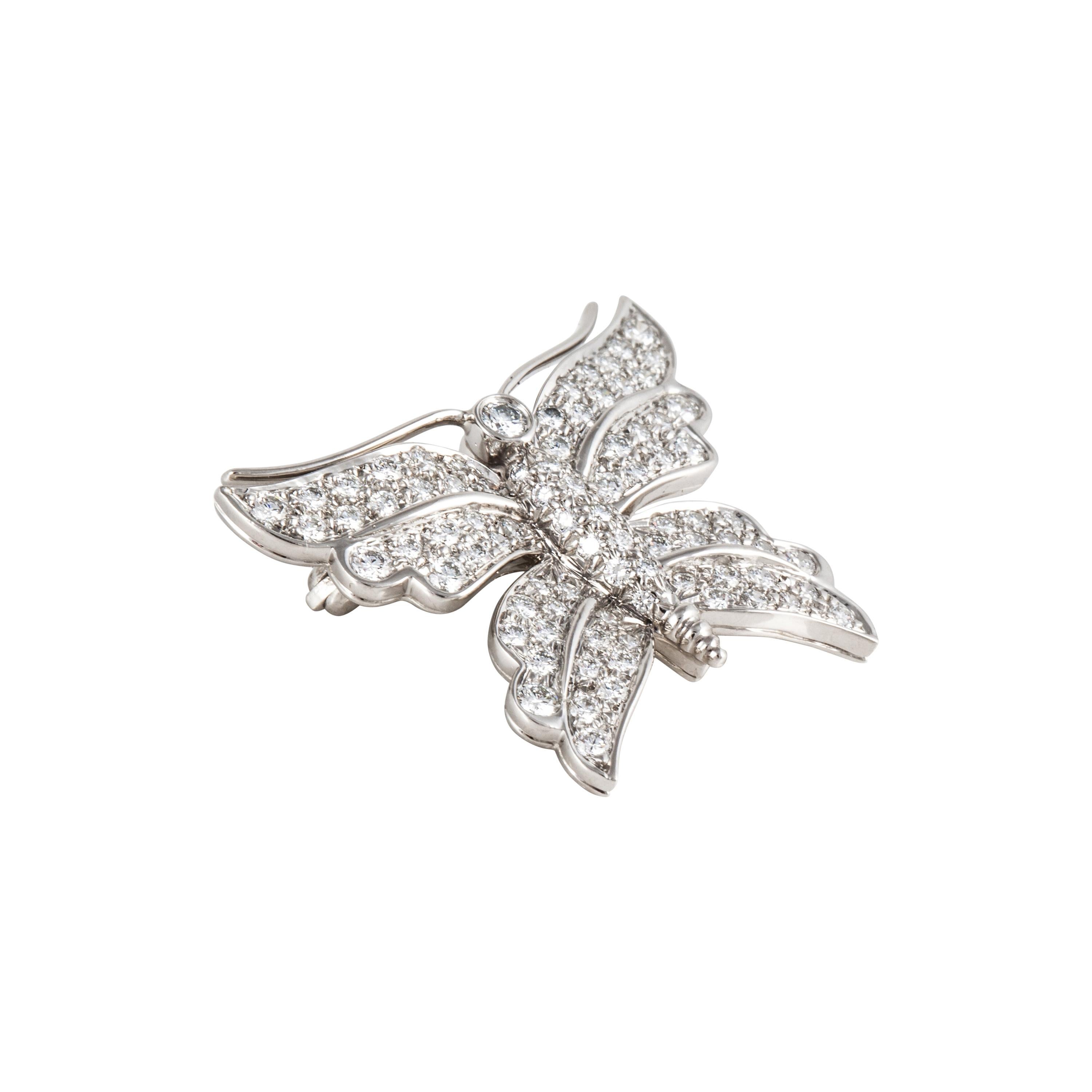 Tiffany & Co. butterfly pin composed of platinum with round diamonds.  There are 90 round diamonds that total 1.50 carats; F-G color and VS1-VS2 clarity.  Measures 1 1/8 inches by 7/8 inches.  Circa 1996.