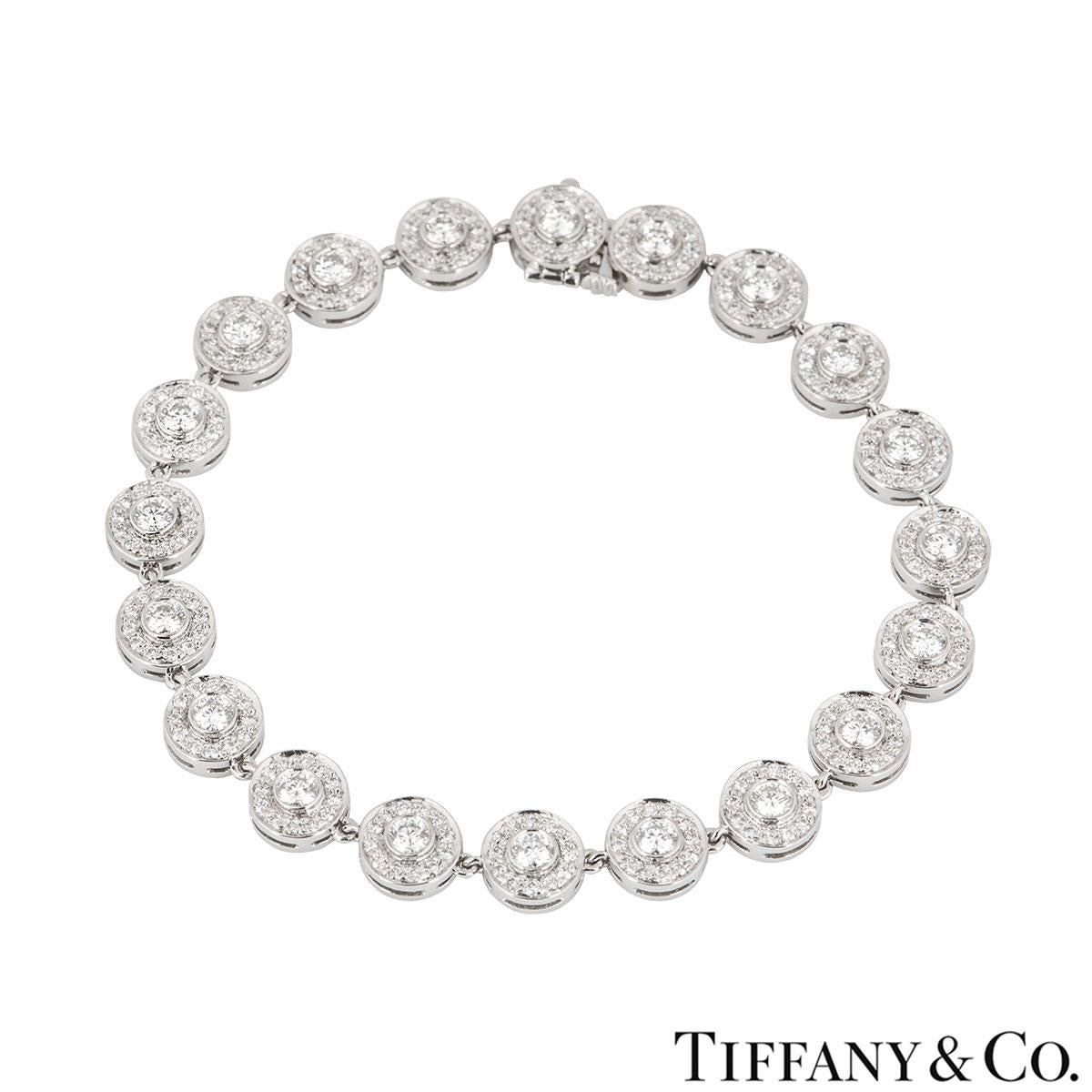 A platinum diamond bracelet by Tiffany & Co. from the Circlet collection. The bracelet features 20 circular motifs set with a single round brilliant cut diamond in the centre and surrounded by pave round brilliant cut diamonds.  The 260 diamonds