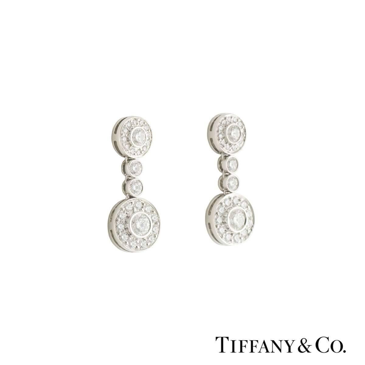 A beautiful pair of platinum diamond Tiffany & Co. earrings from the Circlet collection. The earrings each comprise of a round brilliant cut diamond in a rubover setting with a halo of round brilliant cut diamonds in a pave setting. This motif is