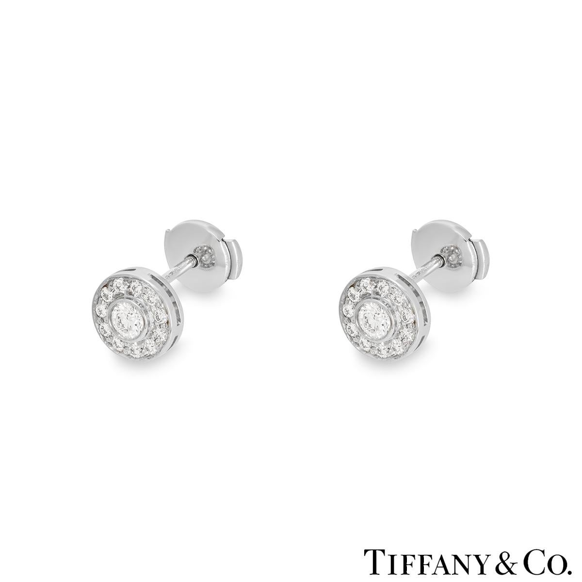A beautiful pair of platinum diamond earrings by Tiffany & Co. from the Circlet collection. Each earring features a bezel set round brilliant cut diamond set to the centre with an approximate total weight of 0.30ct, predominately F colour and VS