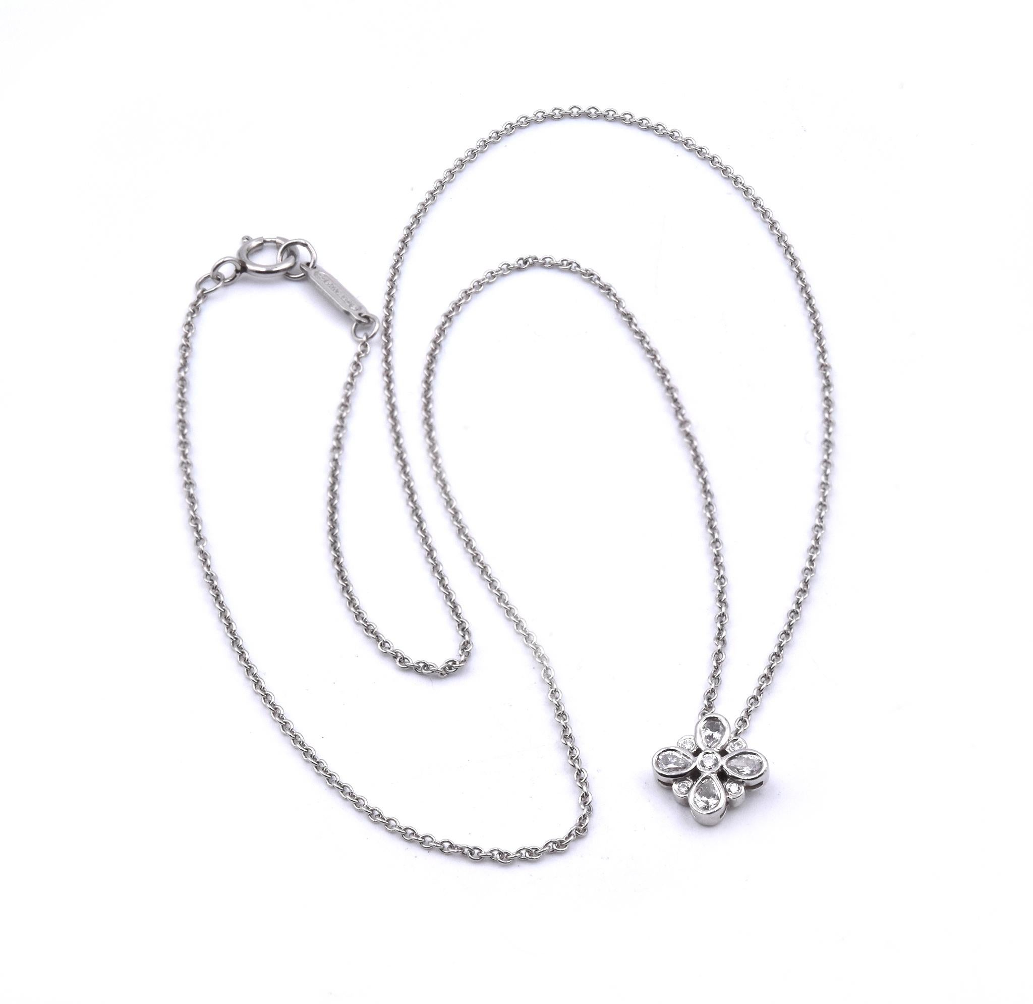 Designer: Tiffany & Co. 
Material: Platinum
Diamonds: 4 pear cut = .16cttw
Color: G
Clarity: VS2
Diamonds: 6 round cut = .06cttw
Color: G
Clarity: VS2
Measurement: necklace measures 16-inches
Weight: 2.8 grams