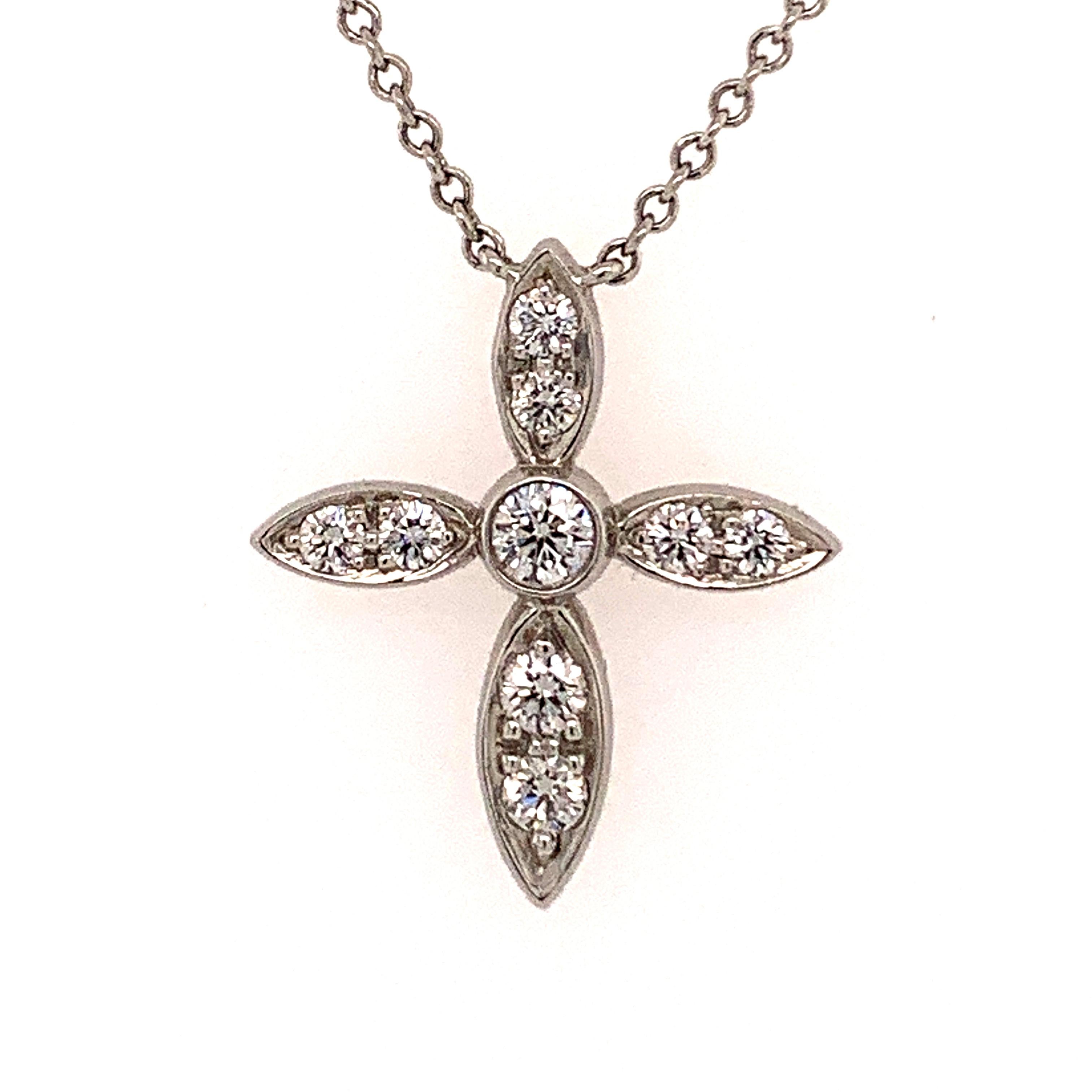 Sparkling diamond cross.  Made and signed by TIFFANY & CO.  Brilliant faceted diamonds, set in platinum.  2/3