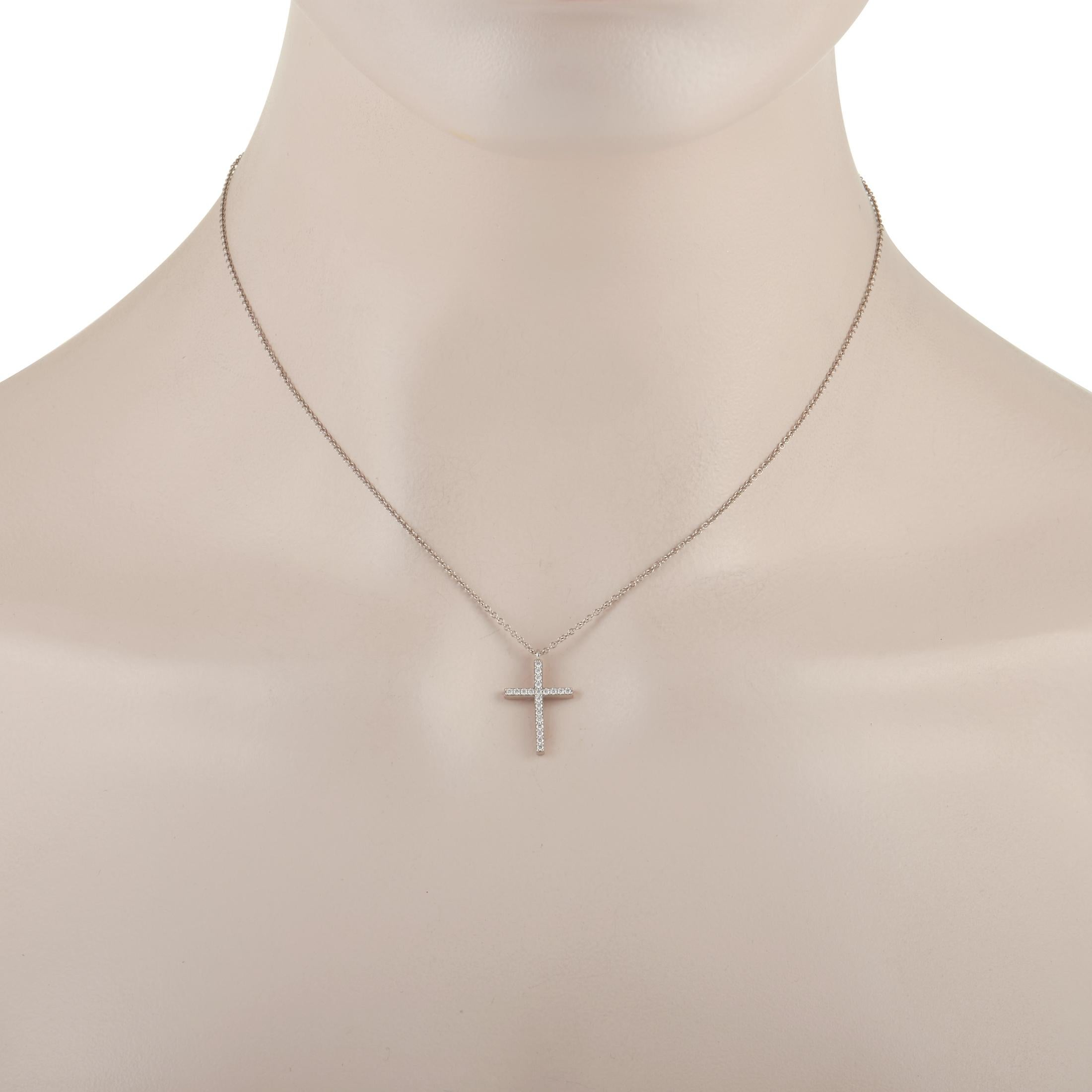 This stylish necklace from Tiffany & Co. is a beautiful celebration of faith. Suspended from a 16” chain, you’ll find an elegant cross-shaped pendant measuring .75” long and .5” wide that is covered in sparkling diamonds. A platinum setting only