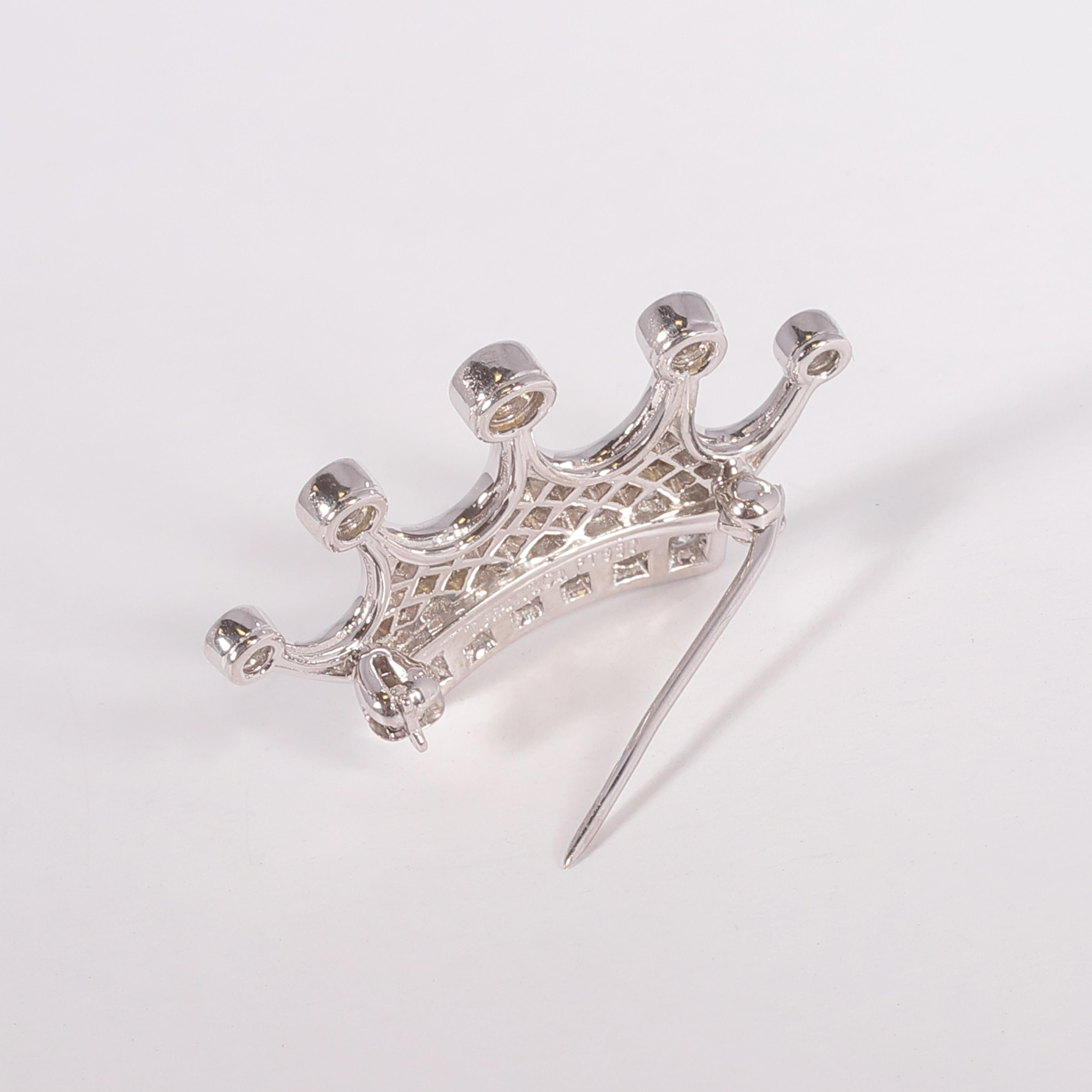 A lovely platinum and 1.00 carat diamond crown brooch by Tiffany & Co. for the royalty in your life!  This petite brooch is secured with a straight line clasp and would be the perfect accent to that scarf!  