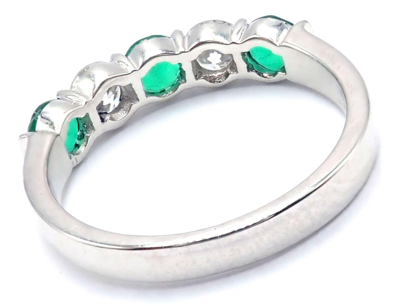 Platinum Diamond And Emerald Band Ring by Tiffany & Co.
With 2 Round brilliant cut diamonds VS1 clarity, E color total weight approximately .50ct
3 Round emeralds total weight approximately .75ct
Measurements: 
Ring Size: 5.5
Weight: 3.9 grams
Band