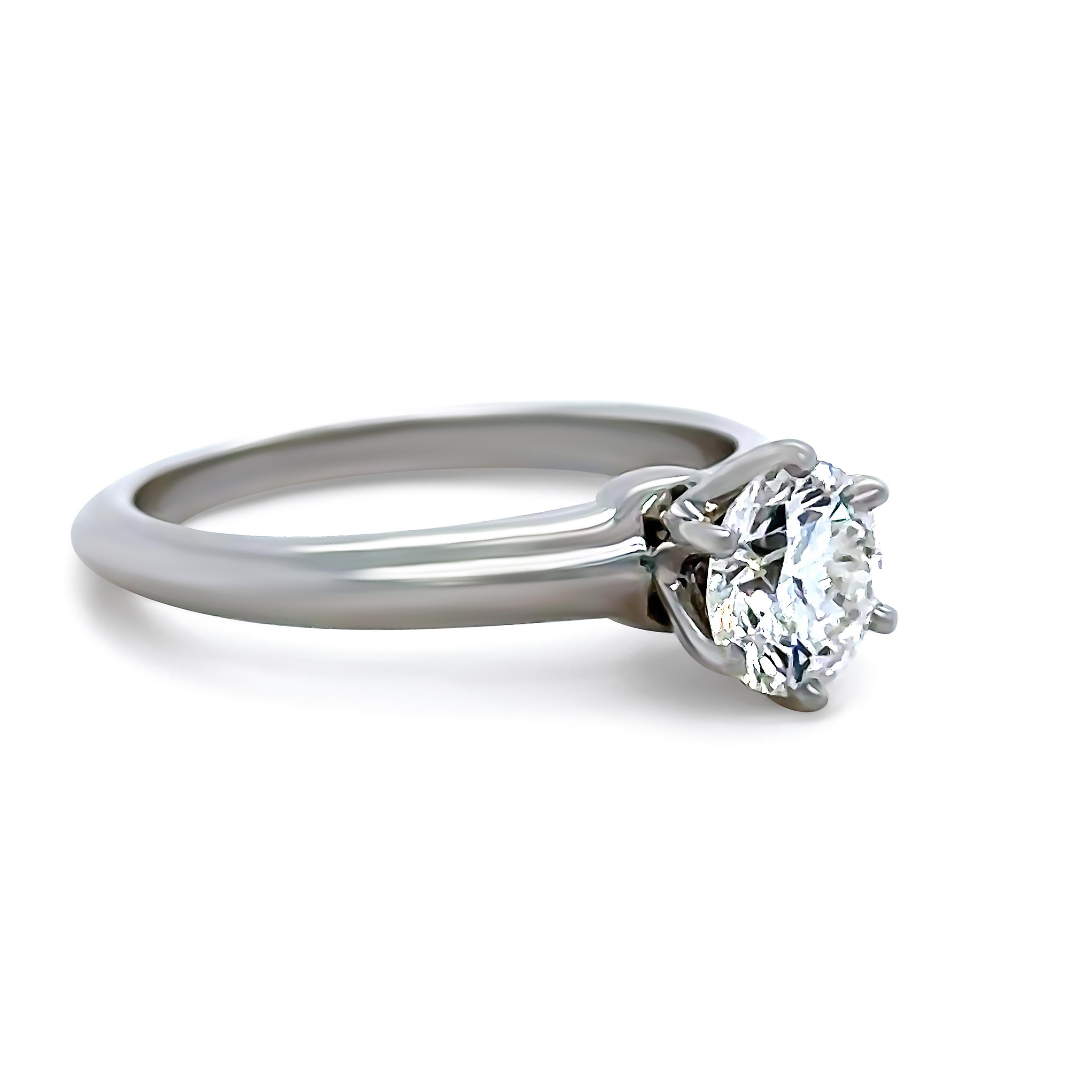 A Tiffany & Co Diamond Engagement Ring, made of 950 Platinum. Set with a Round Brilliant Cut Diamond, H Colour, VS1 Clarity weighing 0.85ct. 

Metal: 950 Platinum
Carat: 0.85ct
Colour: H
Clarity: VS1
Cut: Round Brilliant Cut
Weight: 5.4
