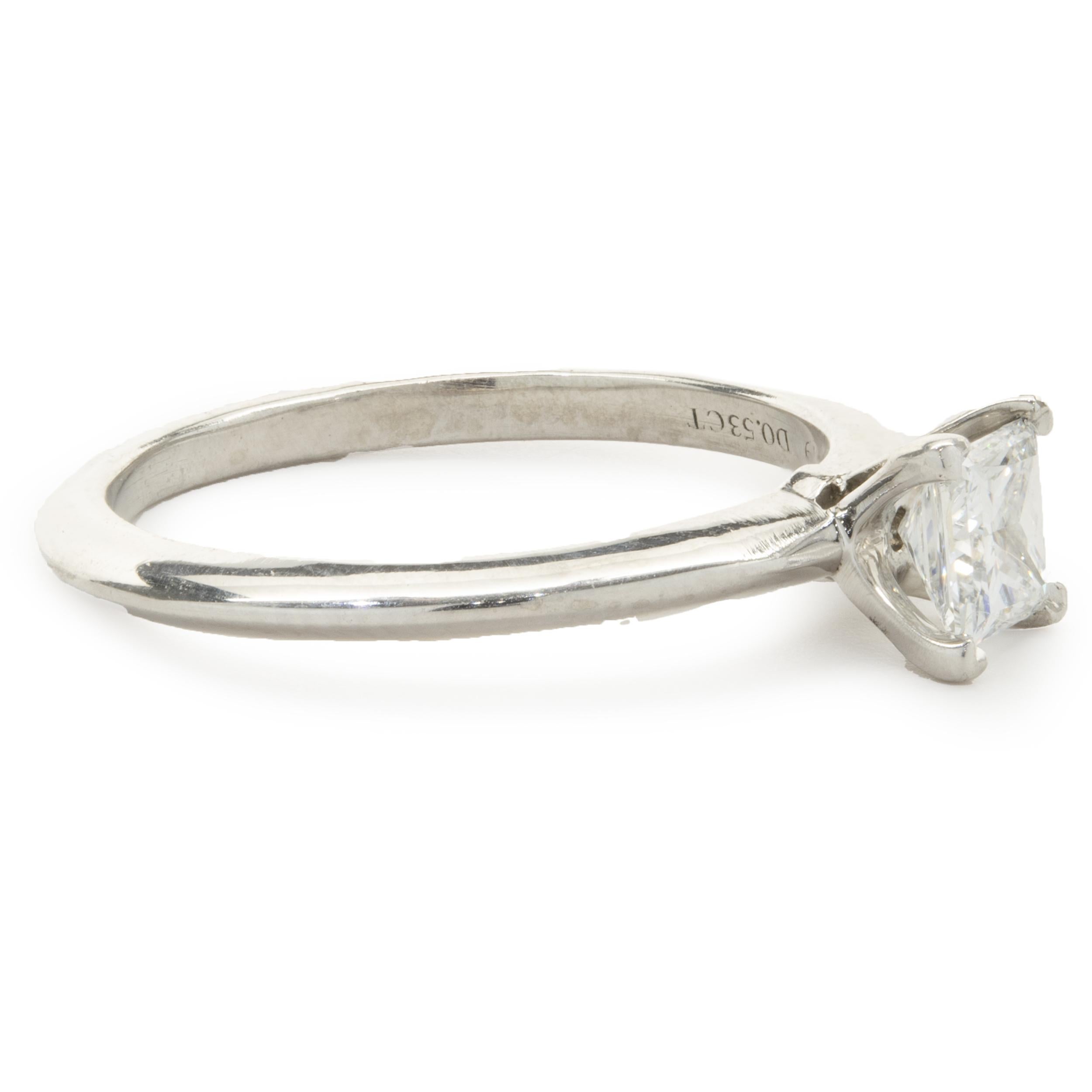 Designer: Tiffany & Co. 
Material: platinum
Diamond: 1 princess cut = .53ct
Color: H
Clarity: VS2
Size: 7
Dimensions: ring top measures 5.70mm wide
Weight: 4.64 grams