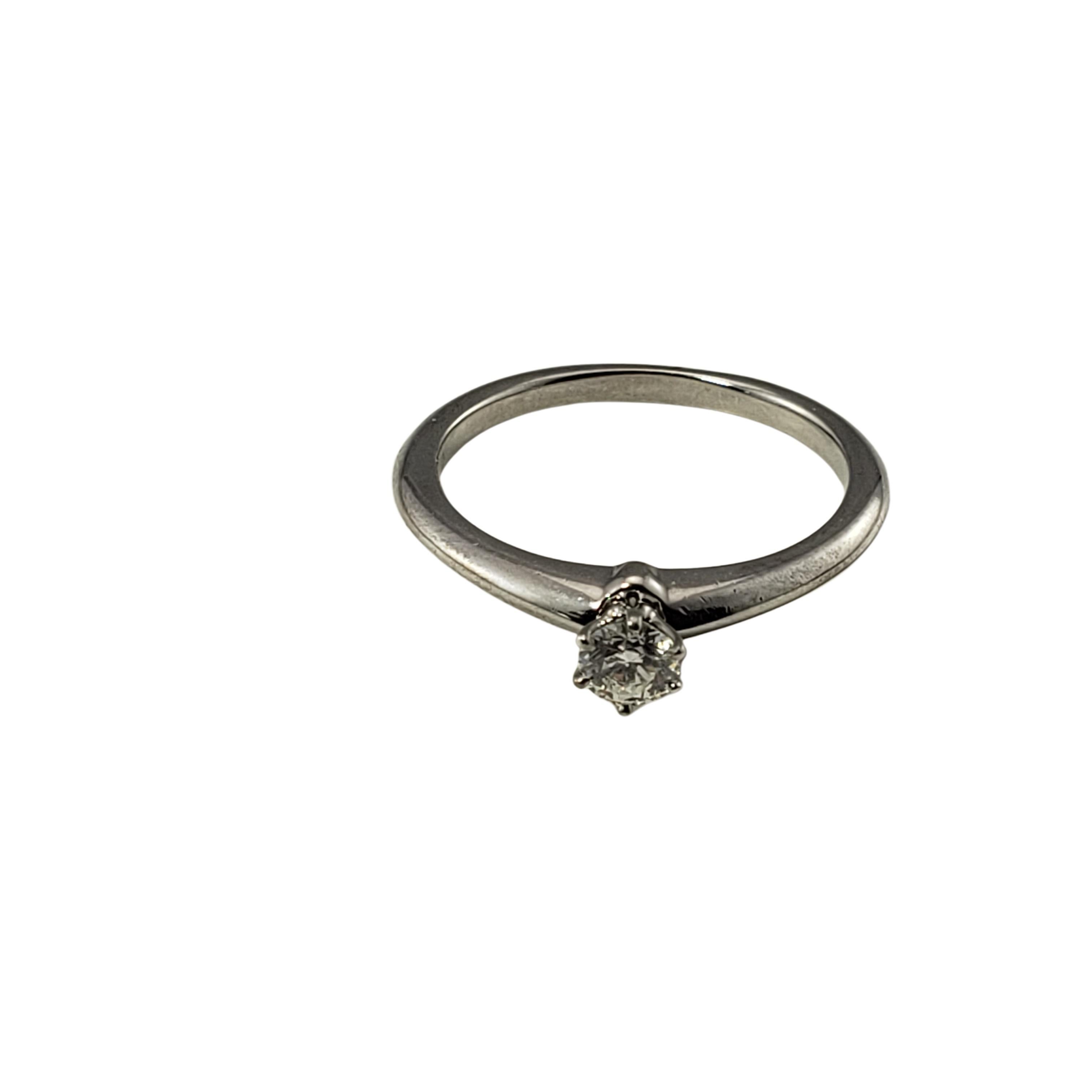 Tiffany & Co Platinum and Diamond Engagement Ring Size 7-

This sparkling engagement ring by Tiffany & Co. features one round brilliant cut diamond set in classic platinum.

Total diamond weight:  .24 ct.

Diamond color:  G

Diamond clarity: 