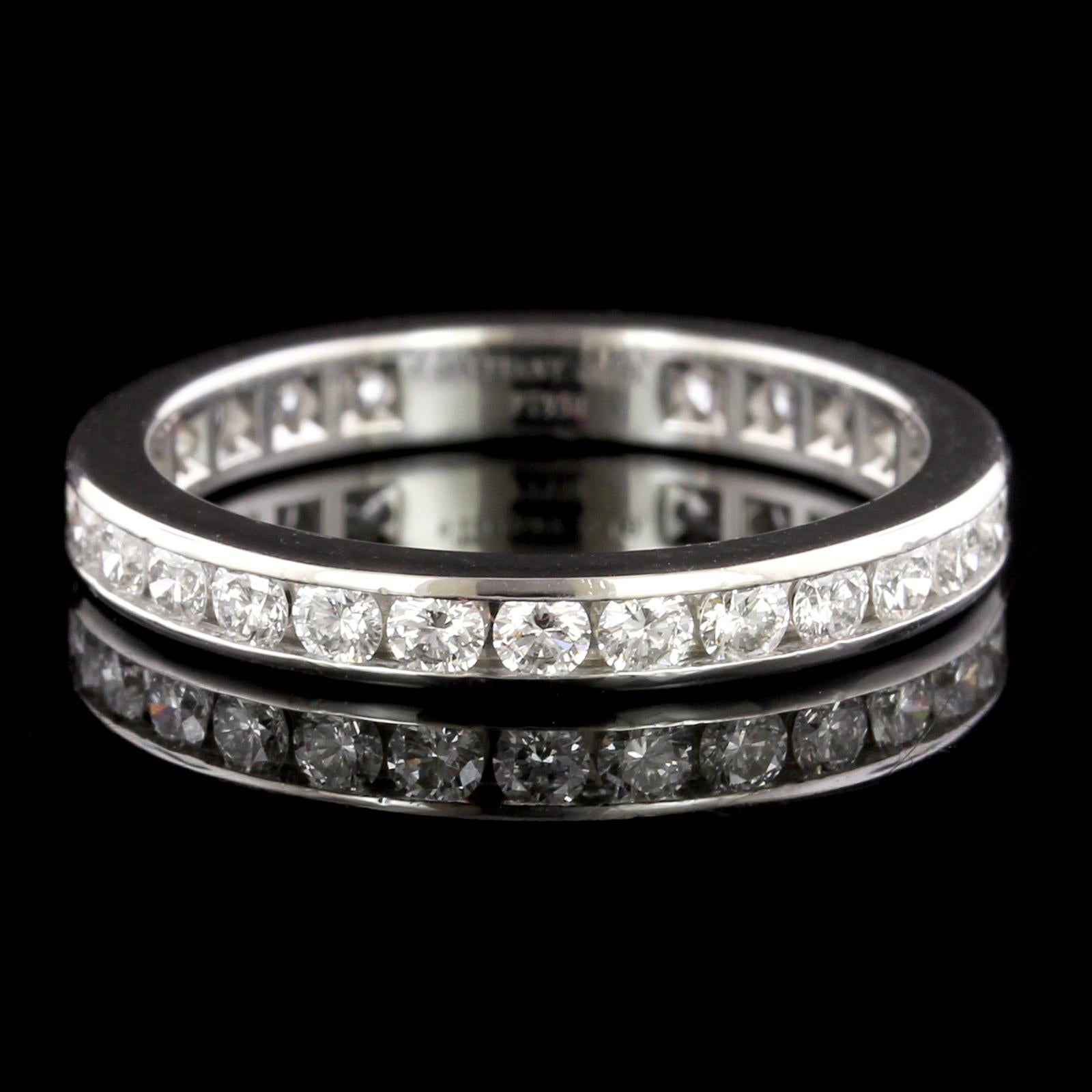 Tiffany & Co. Platinum Diamond Eternity Band. The band is channel set with 29
full cut diamonds, approx. total wt. 1.00cts., F color, VS clarity, size 7 1/2.
 