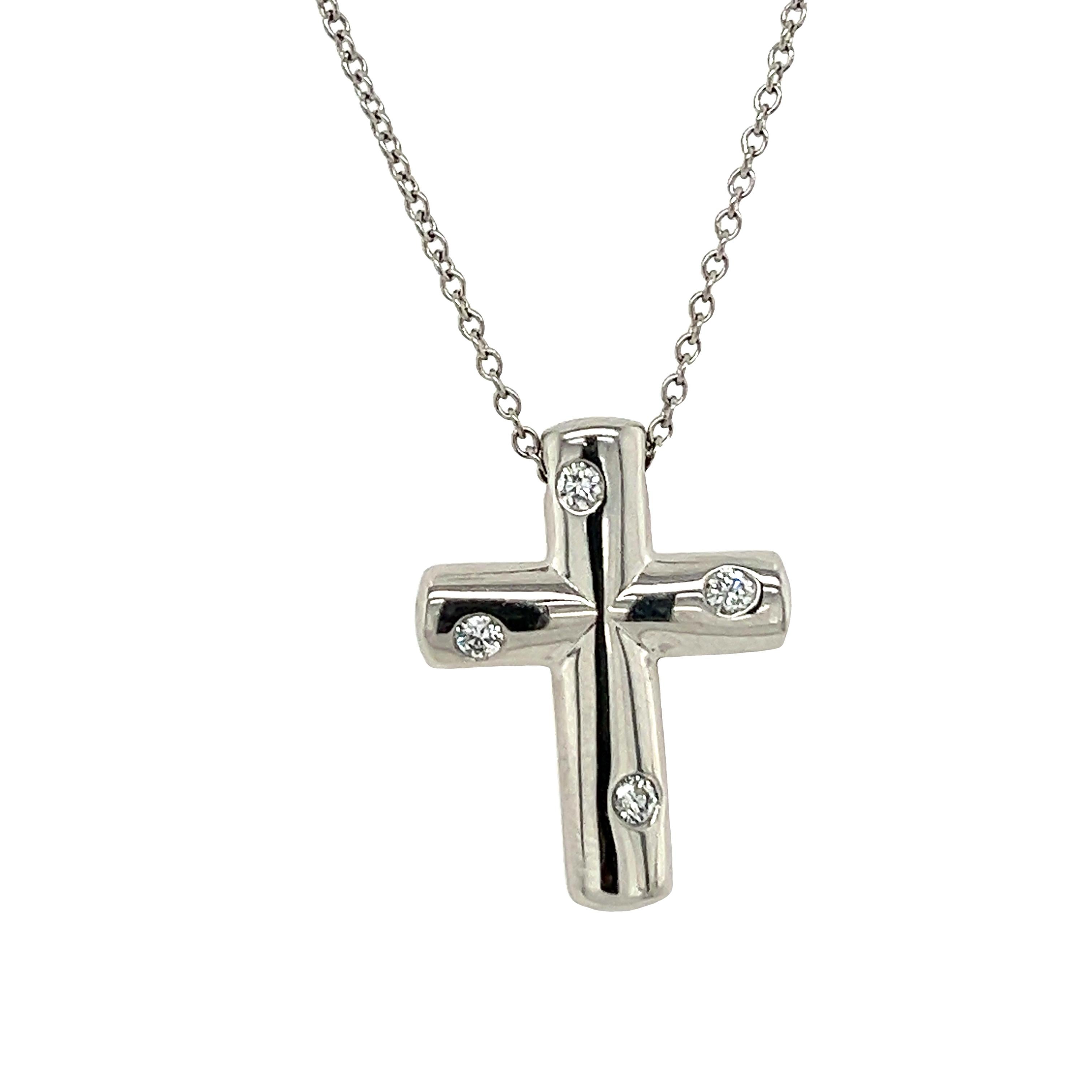 Tiffany & Co. Platinum Diamond Etoile Cross Pendant. Crafted from the finest platinum, this stunning pendant features a captivating cross design adorned with shimmering diamonds from Tiffany's iconic Etoile collection. Paired with a 16-inch platinum