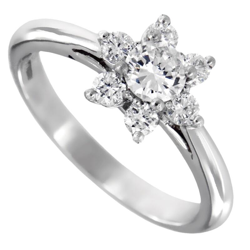 TIFFANY & Co. Platinum Diamond Flower Ring 7.5

Metal: Platinum
Size: 7.5 
Weight: 4.20 grams 
Diamond: 7 round brilliant diamonds, carat total weight .50 approx.
Hallmark: ©TIFFANY&CO. PT950 
Condition: Excellent condition, like new, comes with