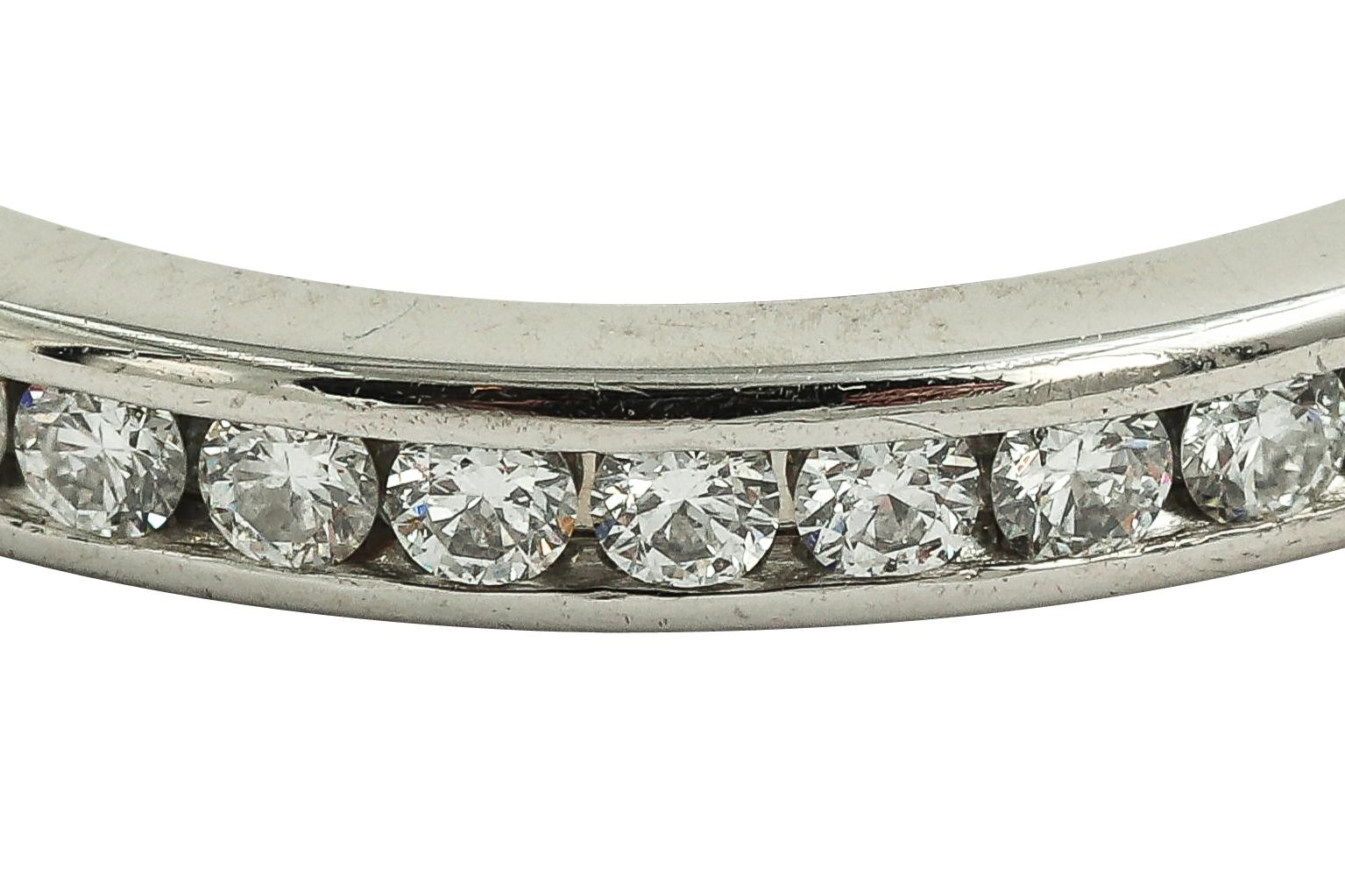 Circa 2000s, constructed from solid platinum, the ring has an array of round cut high quality natural diamonds set along the platinum band. The Diamonds are carefully selected with matching F color VSI quality diamonds. Signed Tiffany & Co. Pt950 on