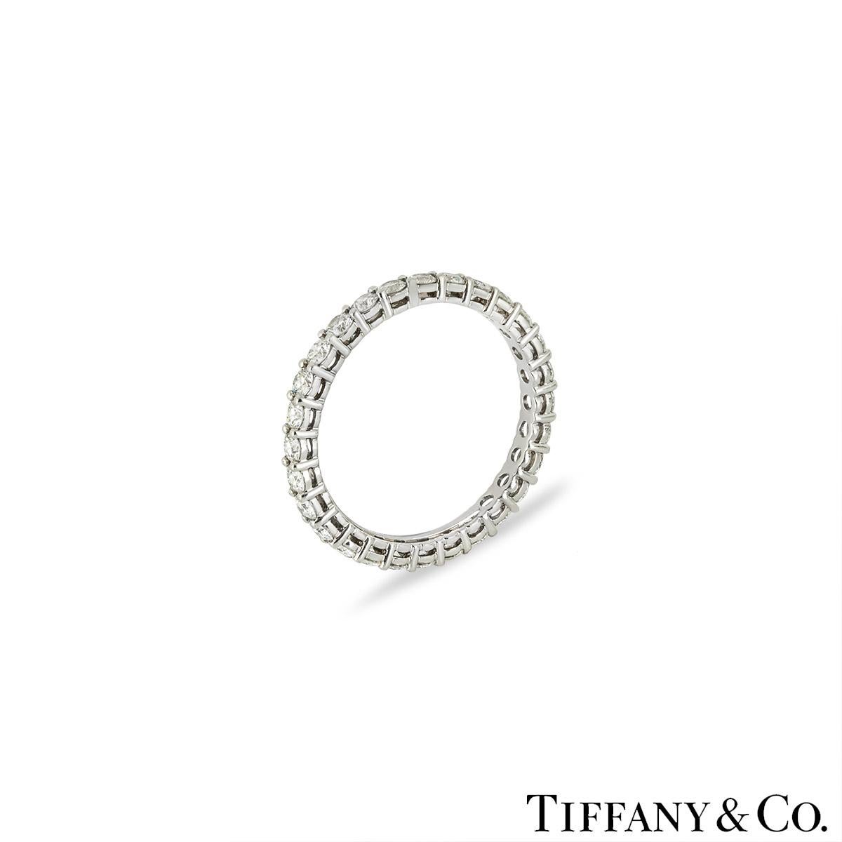 A sparkly platinum diamond full eternity ring by Tiffany & Co. from the Tiffany Forever collection. The wedding band is pave set with 28 round brilliant cut diamonds with an approximate total weight of 0.85ct, F-G colour and VS clarity. The 2.14mm