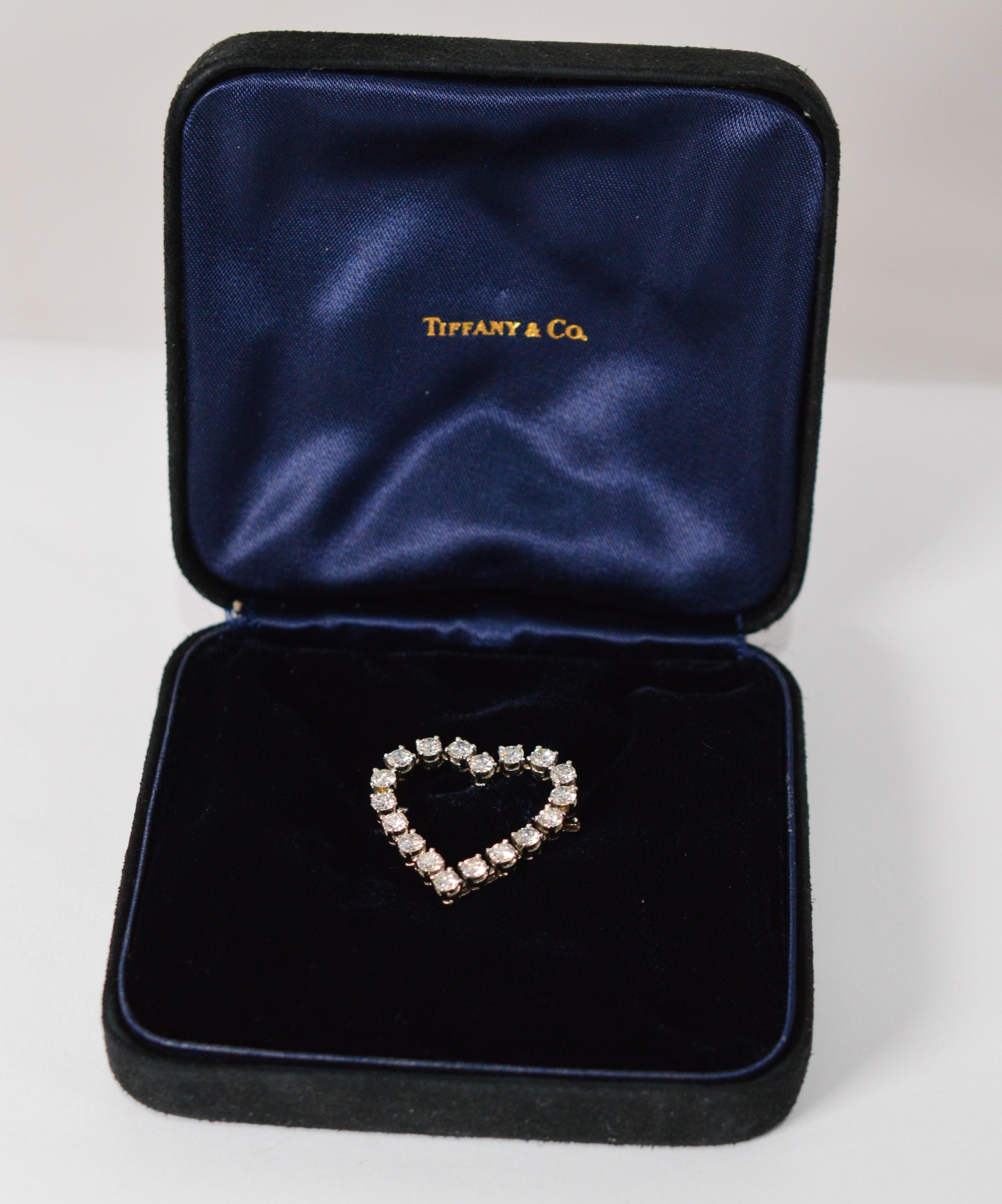 Please your sweetheart with this brilliant vintage Tiffany & Company .900 platinum heart-shaped brooch displaying eighteen G/VS round fine white cut diamonds. Diamonds weight estimated 2.50 carat total weight. The brooch measures 27 mm x 26.79 mm