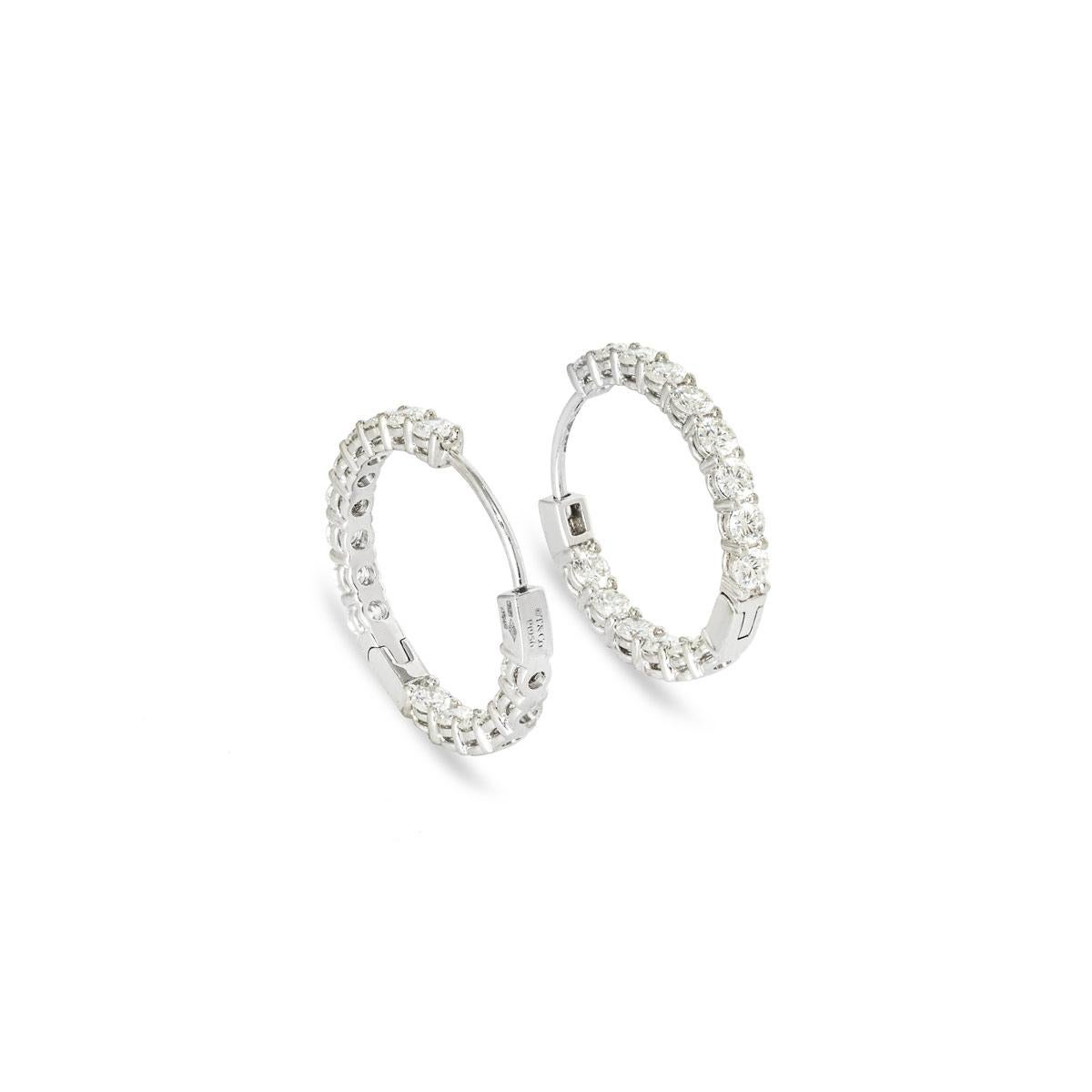A stunning pair of platinum diamond hoop earrings by Tiffany & Co. The earrings are each set to the front and inner side with 15 round brilliant cut diamonds for a combined total diamond weight of 2.39ct. They measure 2.50mm in width and 20.00mm in