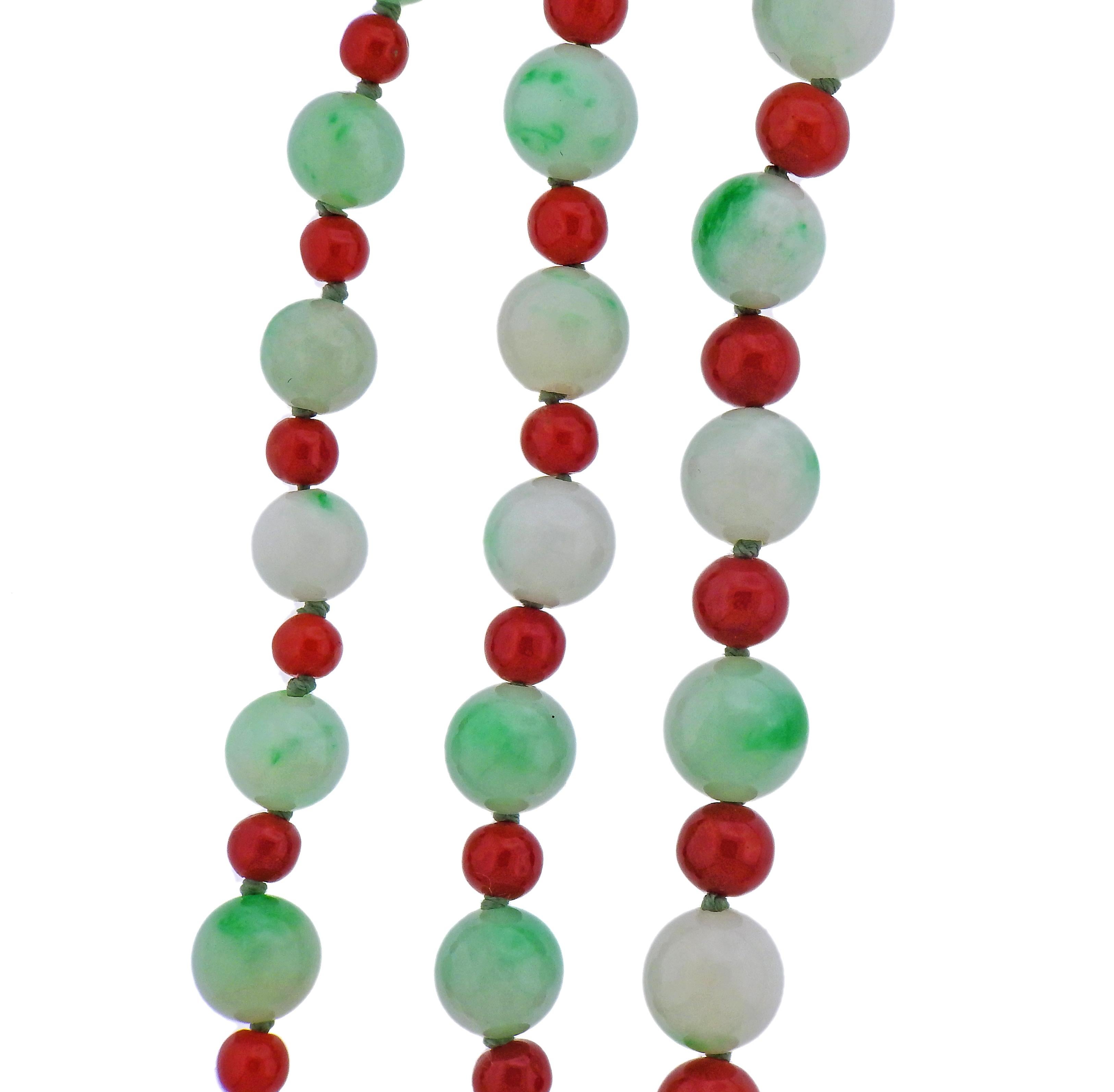 Platinum Tiffany & Co diamond clasp long necklace, with 6-9.5mm jade beads and 4-9.5mm corals. Weight - 156.3 grams. Diamond is approx. 0.74ct. Necklace is 75