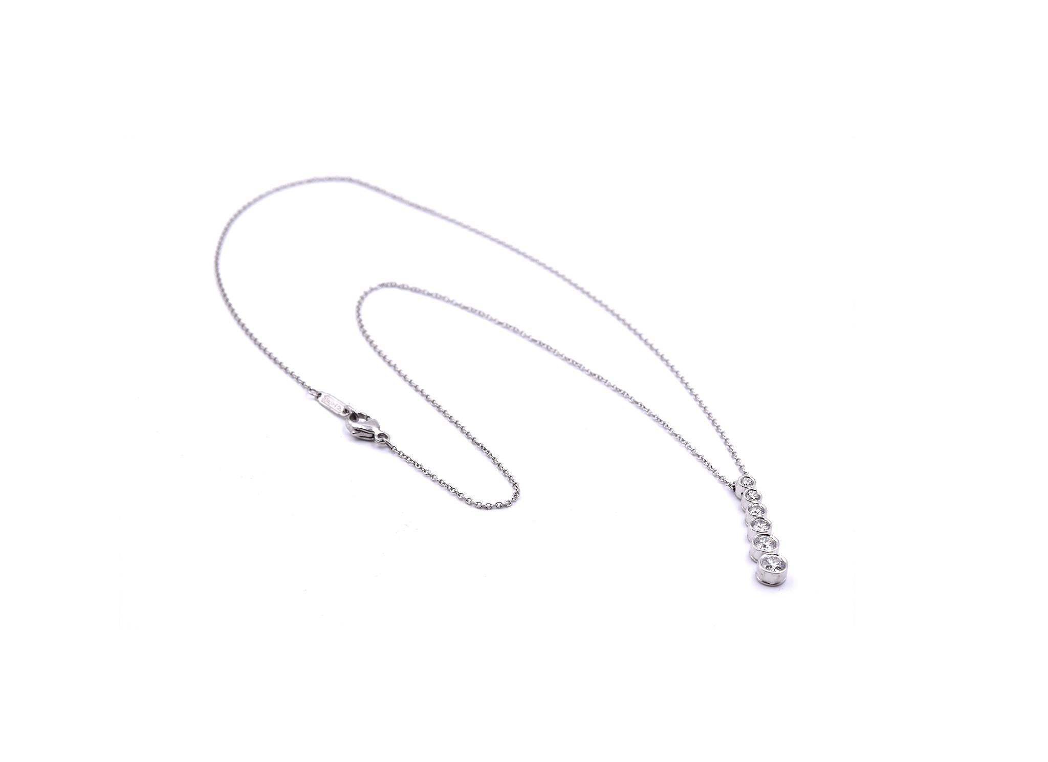 Designer: Tiffany & Co. 
Material: platinum
Diamonds: 6 round brilliant cut= .45cttw
Color: G
Clarity: VS
Dimensions: necklace is 16” long and pendant drop is ¾ of an inch long
Weight: 4.68 grams
