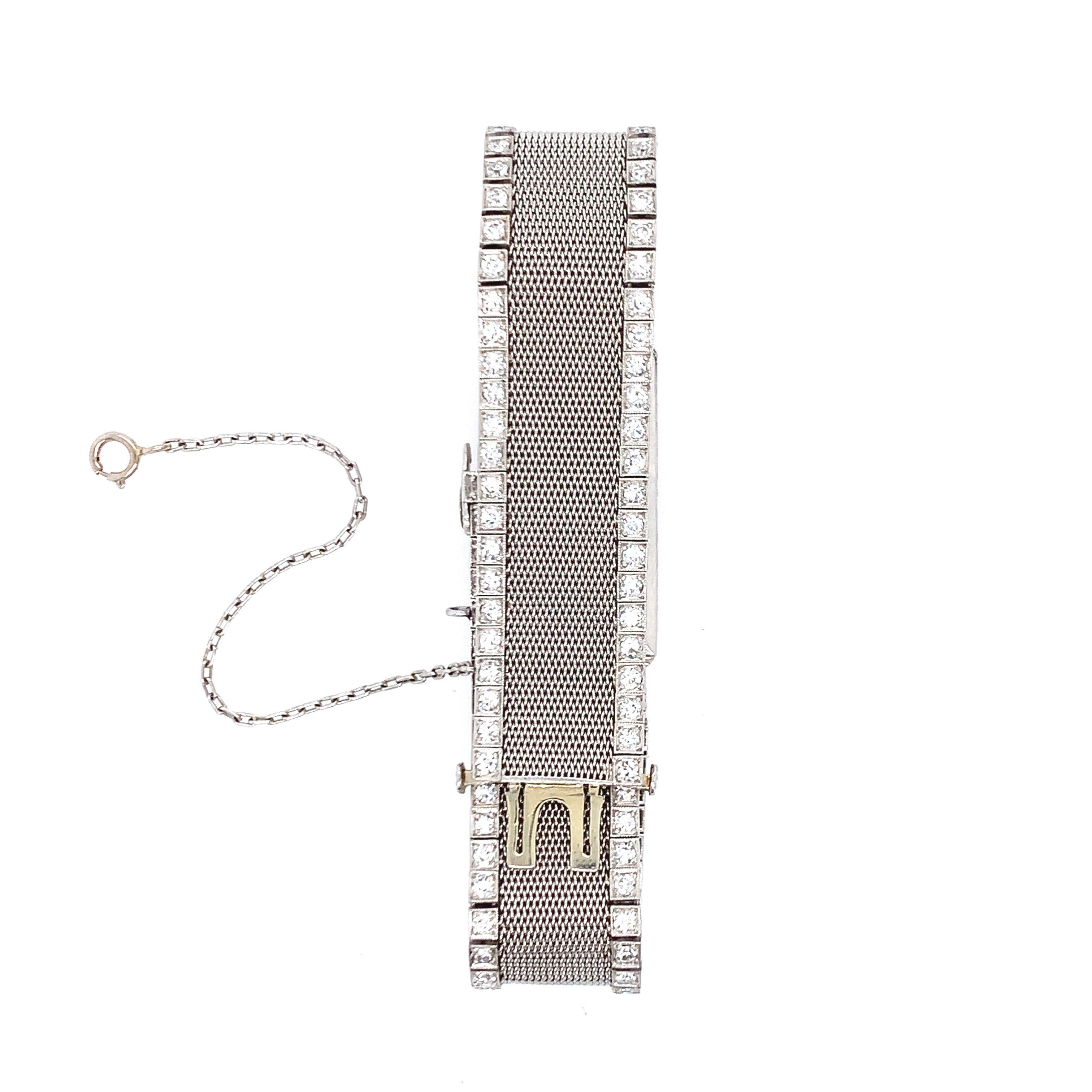 Diese von Tiffany & Co. entworfene Damenuhr ist im Art-déco-Stil gehalten und stammt aus den 1920er Jahren. Das Netzband ist mit Diamanten besetzt. Das Uhrwerk ist von C.H. Meylan und hat 18 Juwelen. Das Gesamtgewicht beträgt 44.4 Gramm. Wird mit