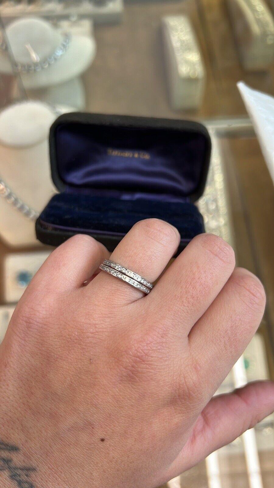 Tiffany & Co. Pair of Platinum & Diamond Eternity Bands w/Box Vintage

Here is your chance to purchase a beautiful and highly collectible designer pair of bands.  Truly a great piece at a great price! 

Each band has 76 round brilliant cut diamonds