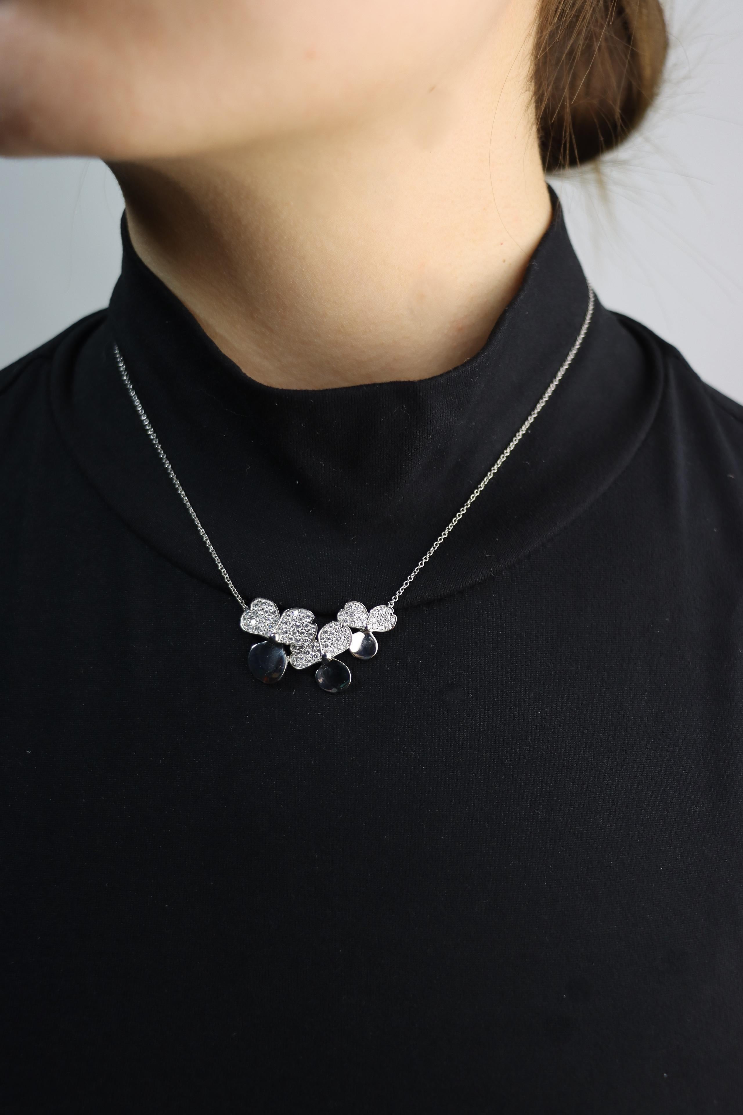 Tiffany & Co Platinum Diamond Paper Flower Pendant Necklace
Marked:
PT950
TIFFANY & Co.

Approximate Dimensions:
41 cm (Chain Length) 
3.2 cm (Length)
1.8 cm (Width)
8.1 grams in weight.