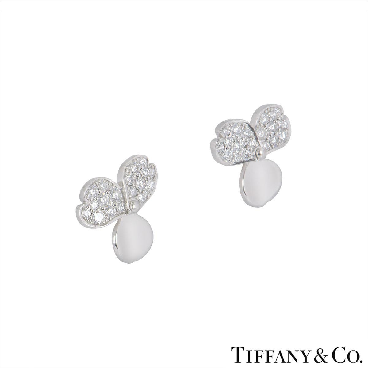 A pair of platinum diamond earrings by Tiffany & Co. from the Paper Flowers collection. The earrings are made up a flower motif with 3 petals, 2 pave set with 38 round brilliant cut diamonds with a total diamond weight of 0.34ct. The earrings have a