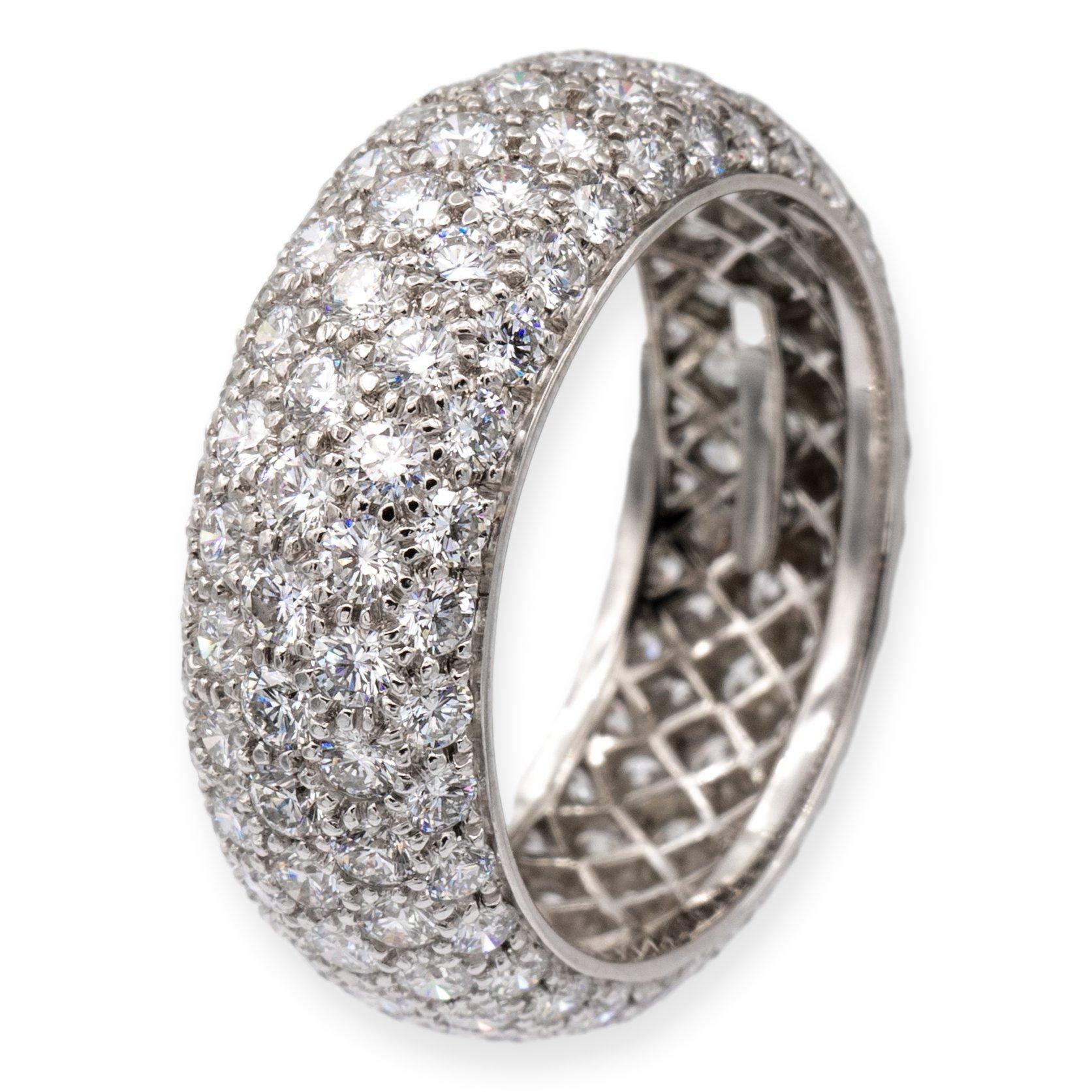 Tiffany & Co. 5 row pave band ring from the Etoile collection finely crafted in platinum with 150 round brilliant cut diamonds bead set all the way around weighing 3.75 carats total weight, F-G color , VVS-VS clarity. The band has a domed design