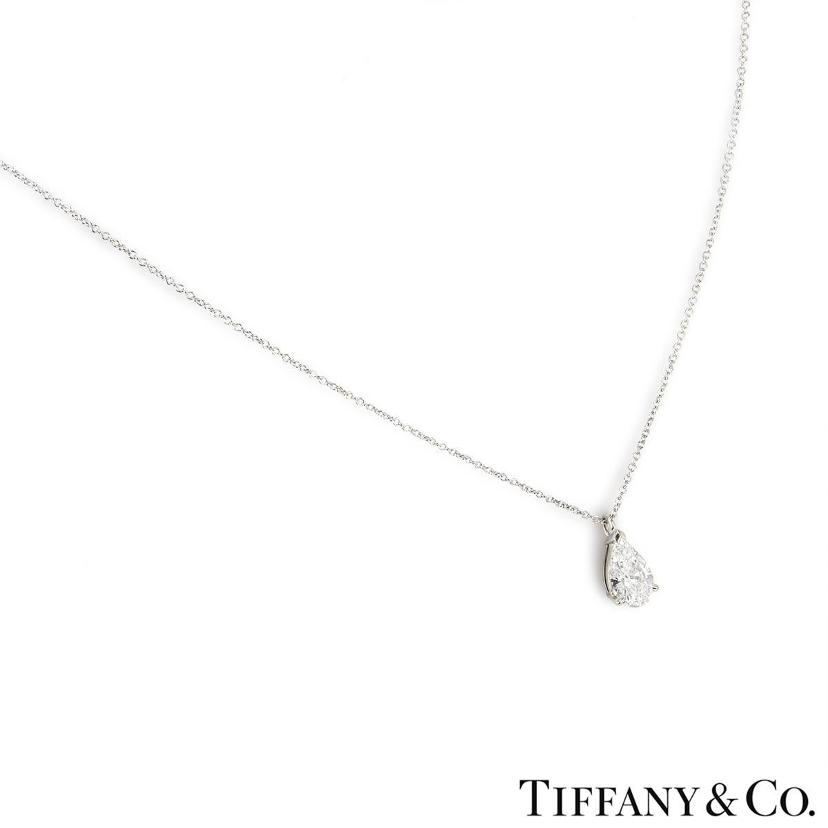 A stunning Tiffany & Co. platinum diamond pendant. The pendant features a single pear cut diamond in a 3 claw setting with a weight of 1.28ct, I colour and VVS2 clarity. The pendant features an 18-inch cable chain with a lobster clasp and a gross