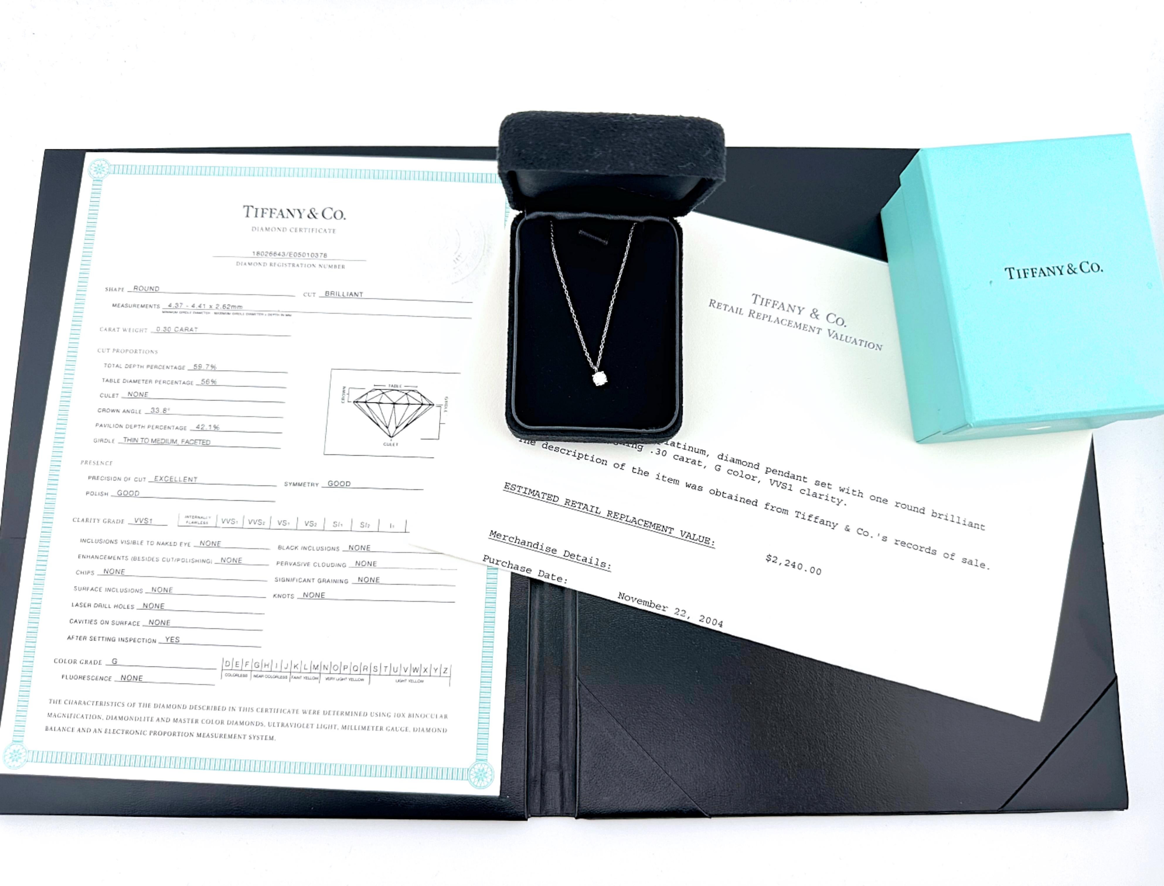 Tiffany & Co. Diamond Pendant Necklace
Style:  Prong Set
Metal:  Platinum
Measurements:  19' Inches
Main Diamond:  Round Brilliant Diamond 0.30 cts
Color & Clarity:  G, VVS1
Includes:  T&C Diamond Certificate - Original Appraisal - Inner & Outer