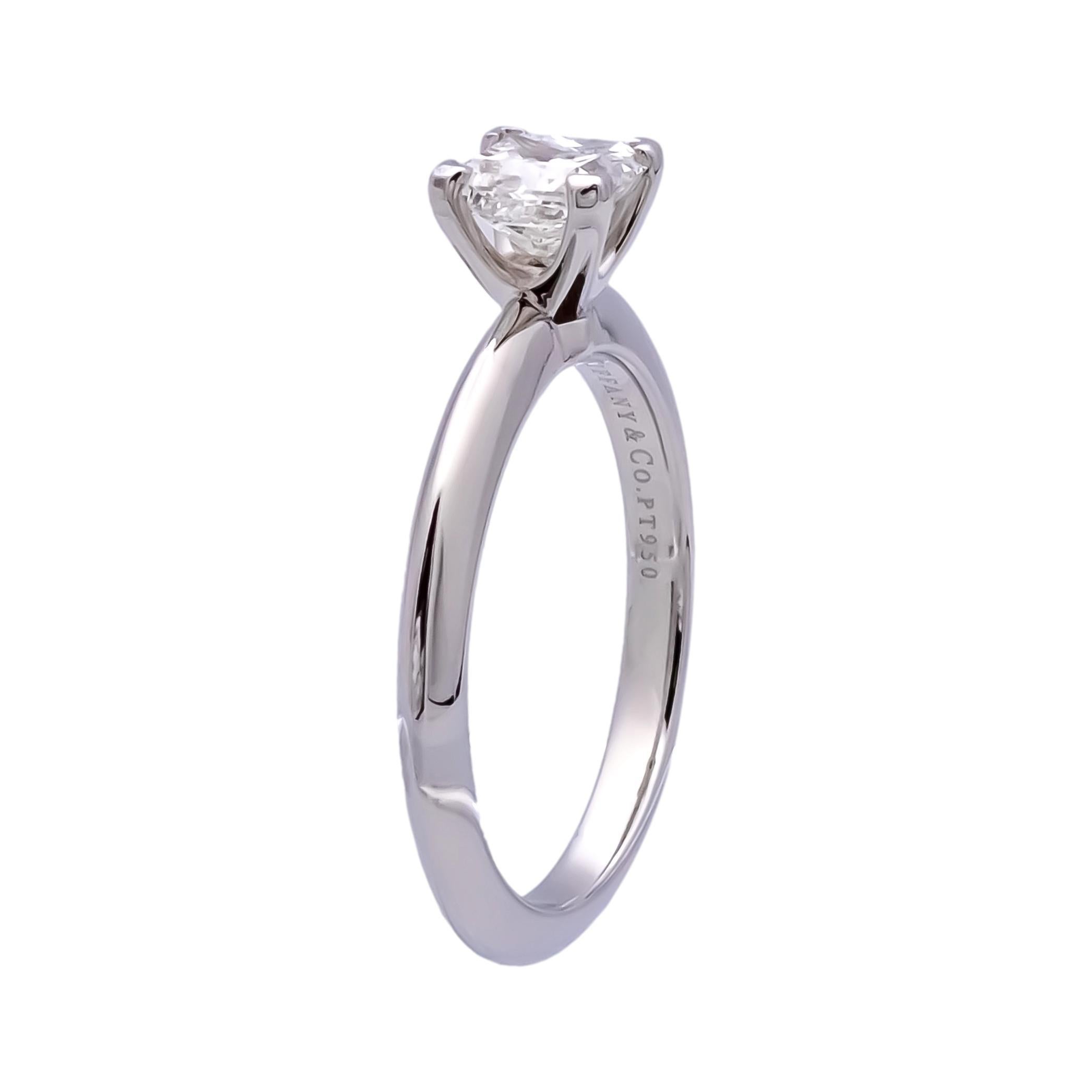 Pre-owned Tiffany & Co. Solitaire Diamond Engagement ring featuring a stunning .67 carat princess-cut diamond center , graded G color and VS2 clarity, taking center stage in a four prong platinum setting. Every detail exudes perfection, from the