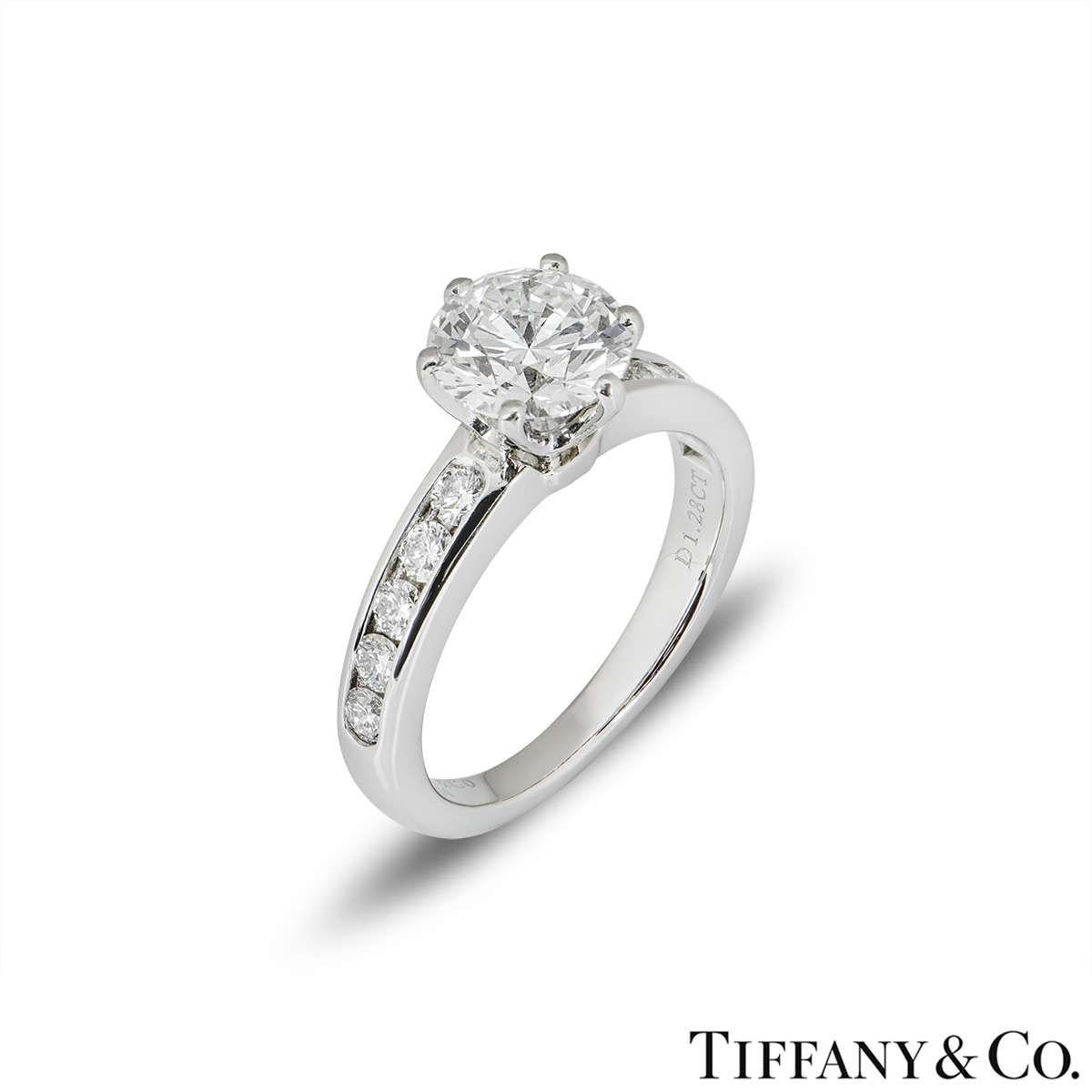 A stunning platinum diamond ring by Tiffany & Co. from the Setting collection. The ring comprises of a round brilliant cut diamond in a prong setting with a weight of 1.28ct, G colour and VVS2 clarity. The ring features 5 round brilliant cut