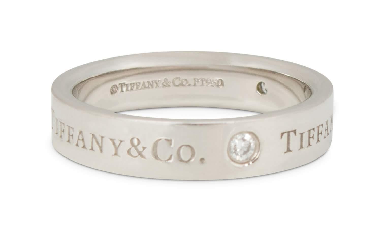 Authentic Tiffany & Co. ring crafted in platinum with 3 round brilliant cut diamonds weighing approximately .04ct each.  Engraved Tiffany & Co. on the outside of the band and signed Tiffany & Co. PT950.  Size 5 3/4.  CIRCA 2010s