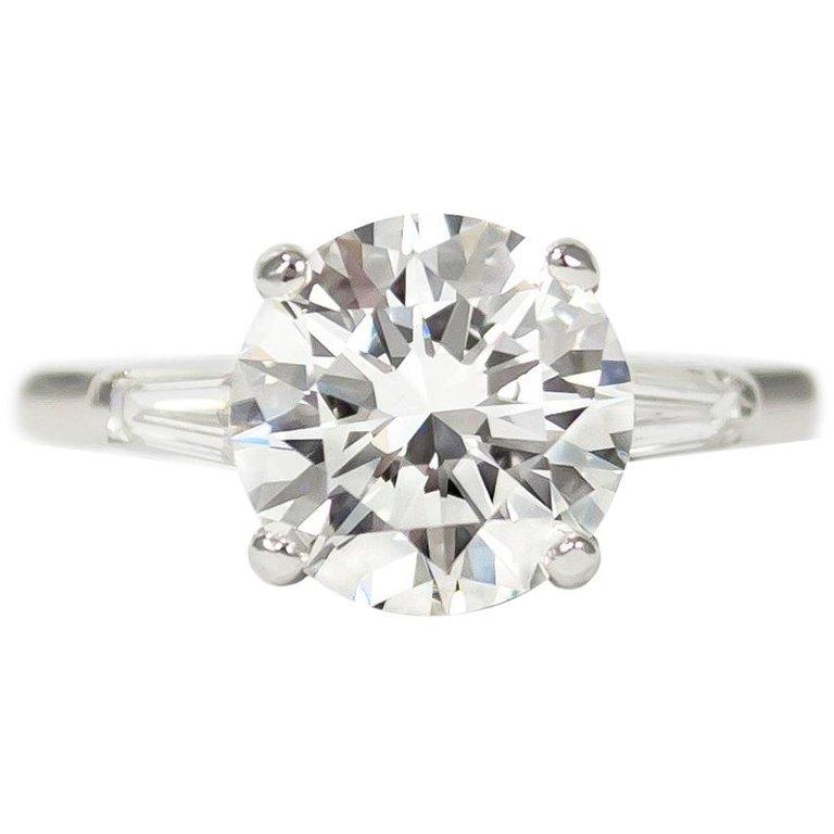 Tiffany & Co. Platinum Round Brilliant Diamond Ring with Tapered Baguettes 2.10ct, VS1, E

Featuring a classic round brilliant center stone set between two tapered baguette diamonds, this Tiffany three stone diamond engagement ring is a study in