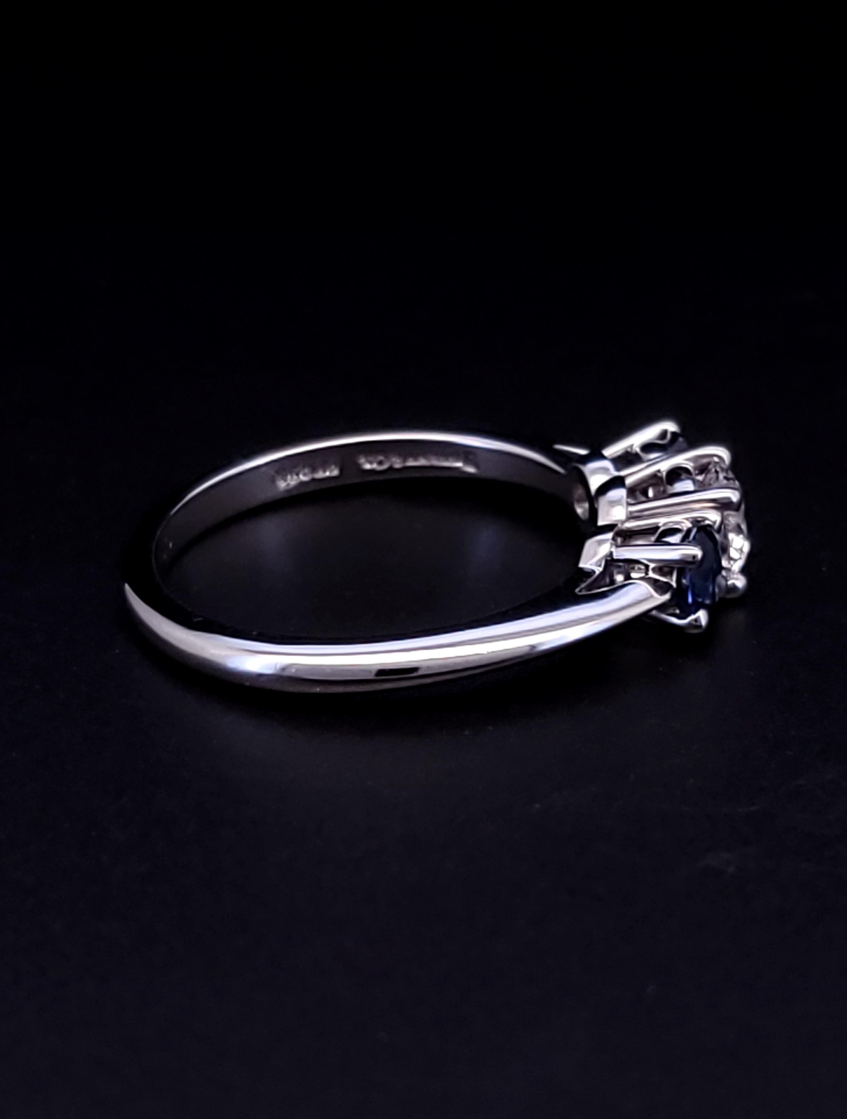 Tiffany 
Co. Platinum diamond sapphire ring

Brand Tiffany 
CO 
Material: Platinum
Condition: Pre-Owned
Ring Size: 6
Center stone: Diamond 0.45ct
Side stones: Sapphire 0.40ct
Band: 1.9mm
Ring Weight: 4.5gm
Comes with a Generic box
