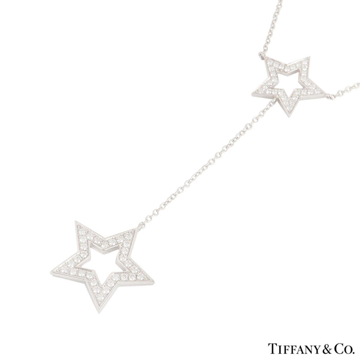 A beautiful platinum diamond set star motifs necklace by Tiffany & Co. The necklace features 2 star motifs on an integrated chain one suspended from the other with pave set round brilliant cut diamonds with an approximate weight of 0.53ct. The