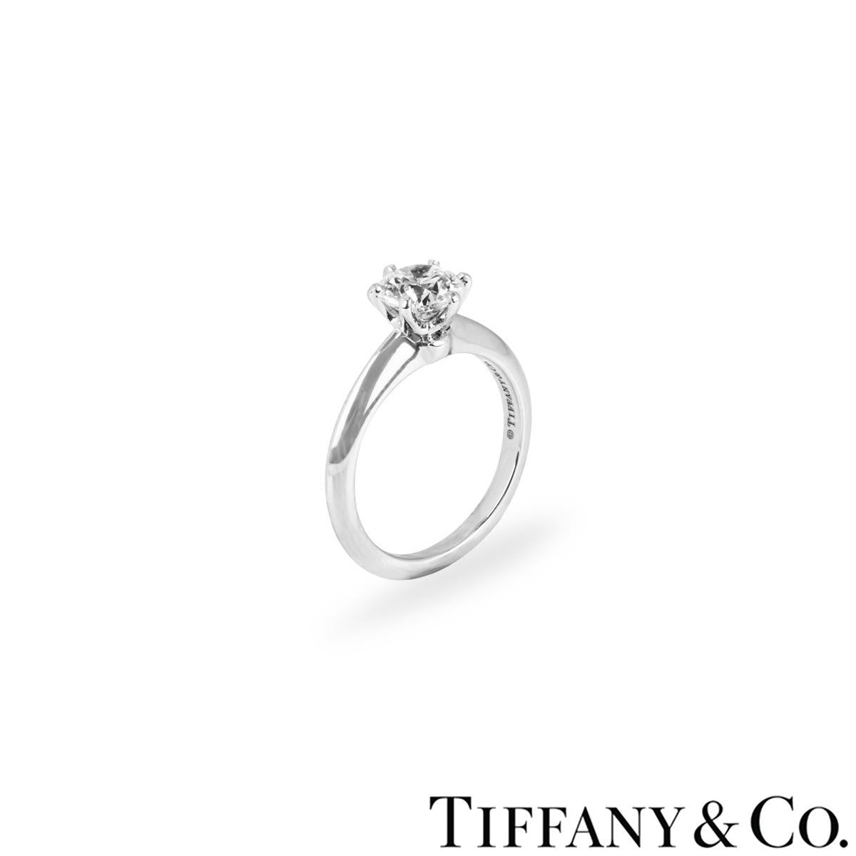 A beautiful platinum diamond ring by Tiffany & Co. from the Setting collection. The engagement ring comprises of a round brilliant cut diamond in a 6 claw setting with a weight of 1.16ct, I colour and VVS1 clarity. The diamond scores an excellent
