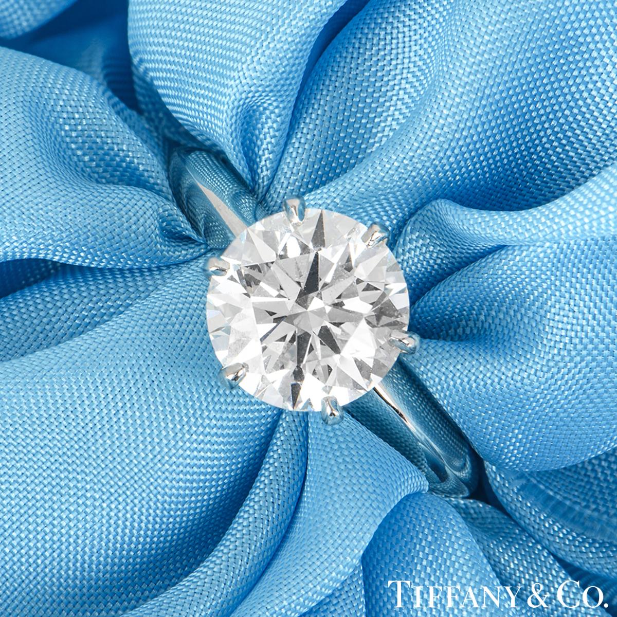A beautiful platinum diamond ring by Tiffany & Co. from The Setting collection. The ring comprises of a round brilliant cut diamond in a 6 claw setting with a weight of 2.13ct, H colour and VVS1 clarity as clarified on the recent GIA diamond report.