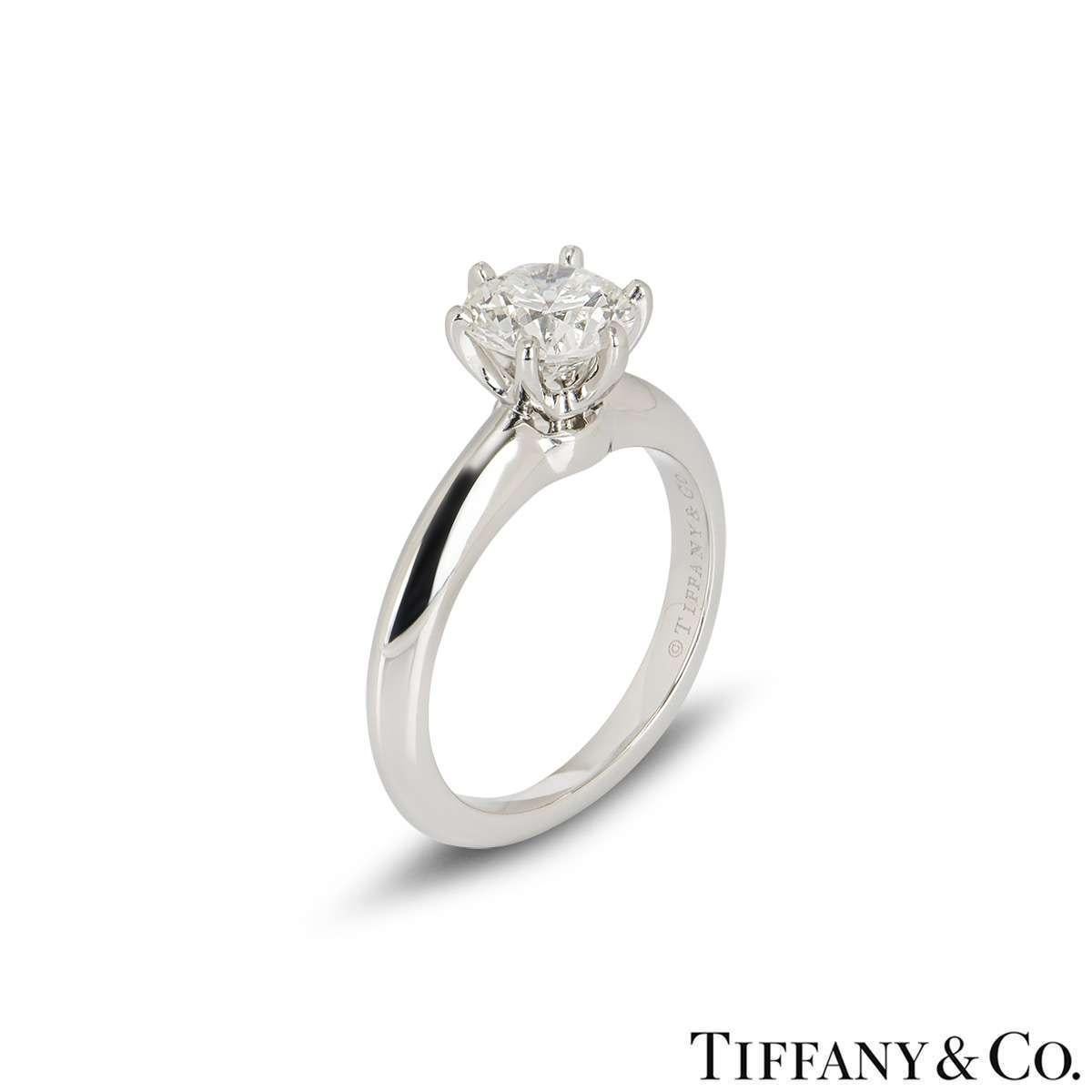 A beautiful platinum diamond ring by Tiffany & Co. from The Setting collection. The ring comprises of a round brilliant cut diamond in a 6 claw setting with a weight of 1.01ct, I colour and VS2 clarity. The diamond scores an excellent rating in all