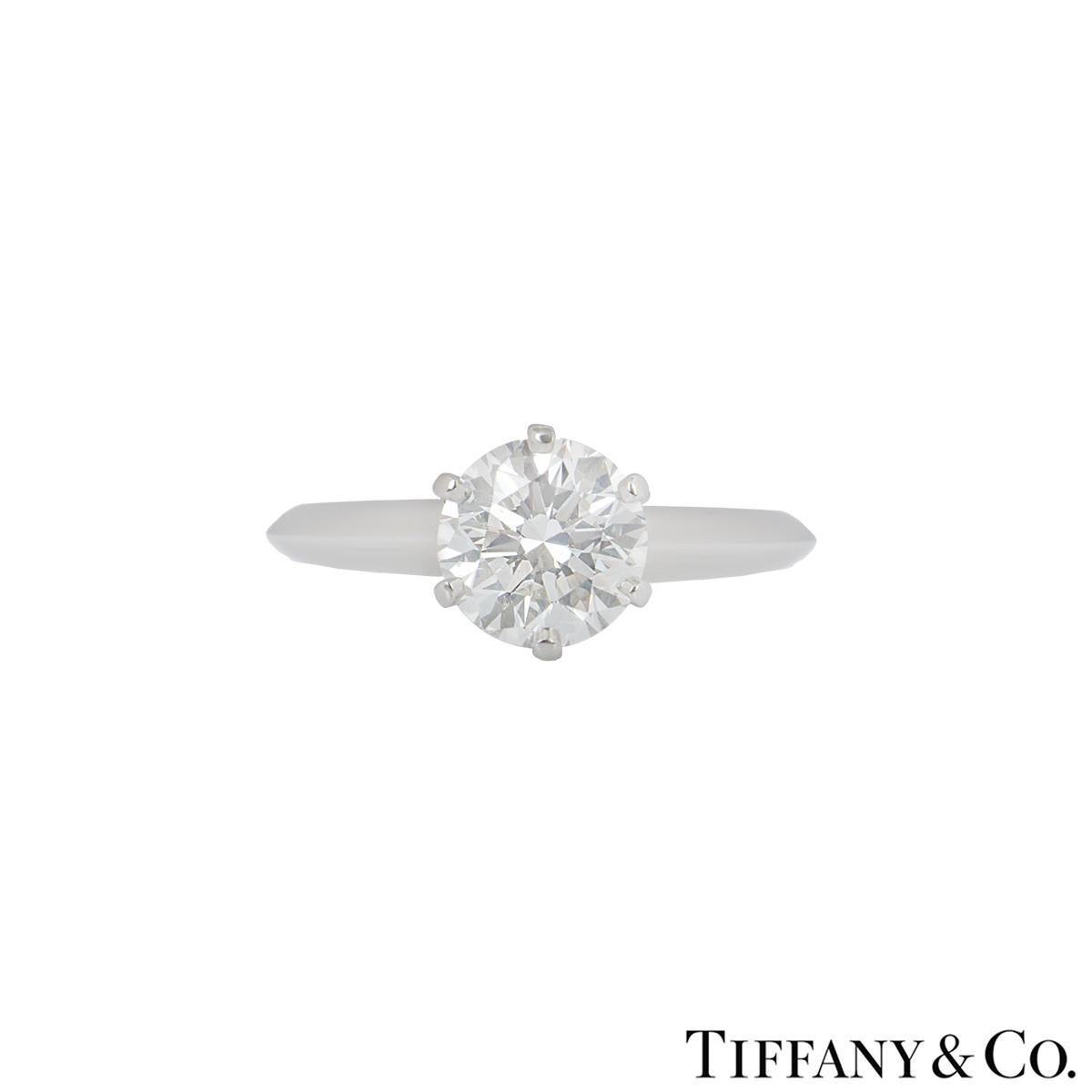 A beautiful platinum Tiffany & Co. diamond engagement ring from the setting collection. The ring comprises of a round brilliant cut diamond in a 6 claw setting with a weight of 1.50ct, I colour and VS1 in clarity. The ring is currently a size is