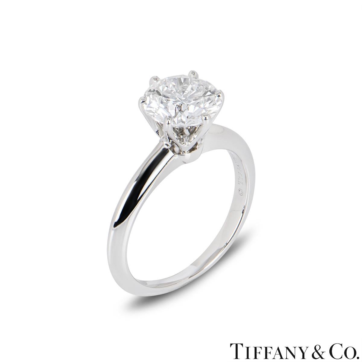 A stunning platinum diamond ring by Tiffany & Co. from the Setting collection. The ring comprises of a round brilliant cut diamond in a 6 claw setting with a weight of 1.52ct, D colour and VS2 clarity. The ring is a size UK I & US 4.5 but can be